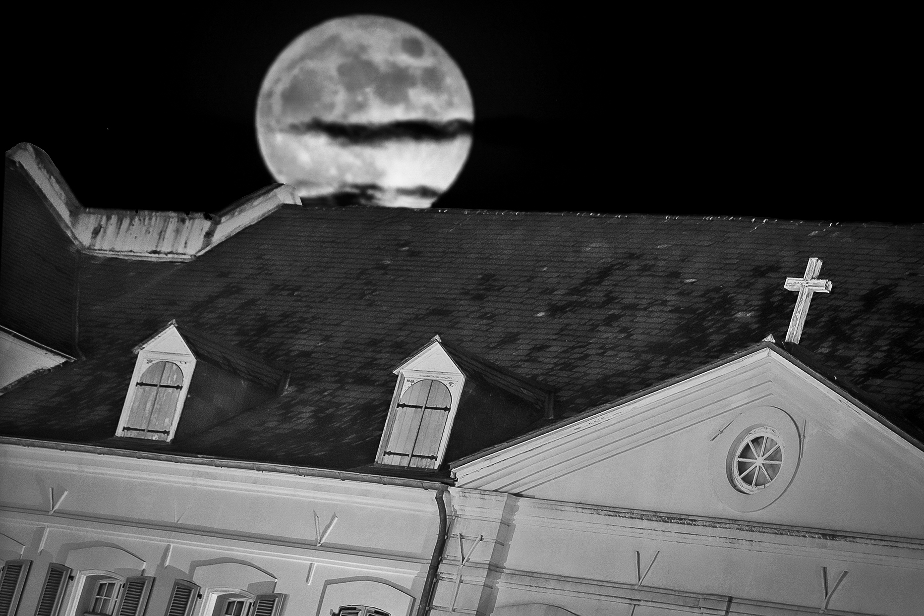 The third floor windows of the Old Ursuline Convent on Chartres Street are said to be permanently sealed because of the Casket Girls. (Photo illustration by Michael DeMocker)