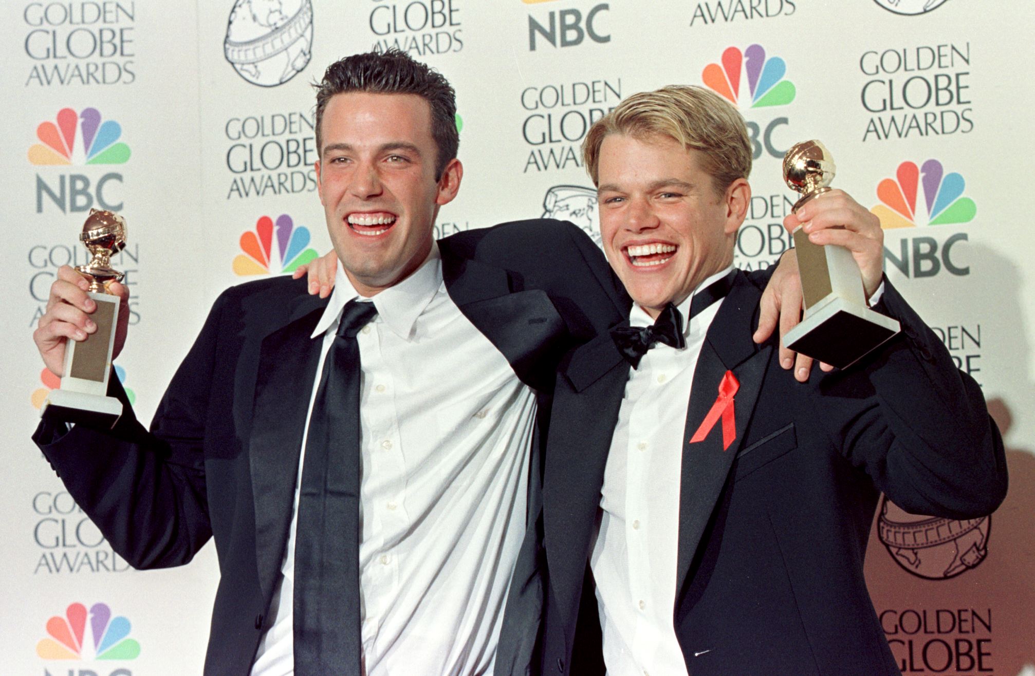 BEVERLY HILLS, CA - JANUARY 18:  Actor Matt Damon (R) and co-writer Ben Affleck (L)  pose with their Golden Globe award for Best Screenplay for "Good Will Hunting" at the 55th Annual Golden Globe Awards at the Beverly Hilton 18 January in Beverly Hills, CA.  Damon, who also stars in the movie, is nominated for a Best Actor award in the drama category. AFP PHOTO    Hal GARB/mn  (Photo credit should read HAL GARB/AFP via Getty Images)