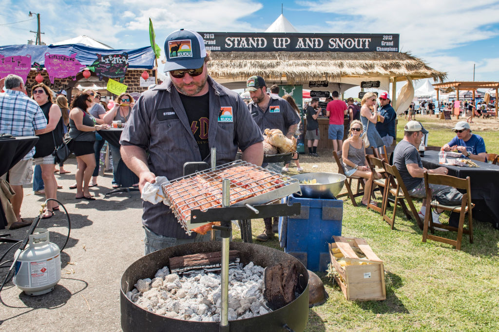 NEW ORLEANS, LA - APRIL 01:  KUDU Grills founder Stebin Honre and Chef Justin Devillier grill ribs at Hogs For The Cause Festival at UNO Lakefront Arena Grounds on April 1, 2017 in New Orleans, Louisiana.  (Photo by Erika Goldring/Getty Images)