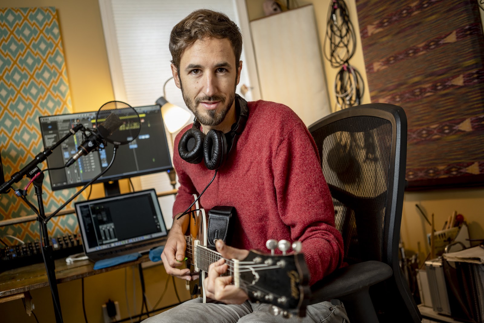 Ian Coss, producer of Forever is a Long Time in his home studio in Medford, MA, where he produces both podcasts and music. Photo by Jodi Hilton