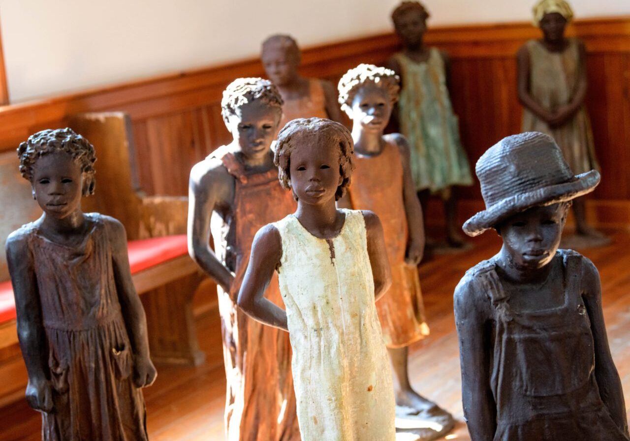 Terra-cotta statues of child slaves created by artist Woodrow Nash are seen inside of a church at the Whitney Plantation in  Wallace, La. in St. John Parish Wednesday, Oct. 2, 2019. When the WPA, Works Progress Administration, began interviewing former slaves in the 1930s in Louisiana most talked about their experience as children during slavery. Photo by Matthew Hinton