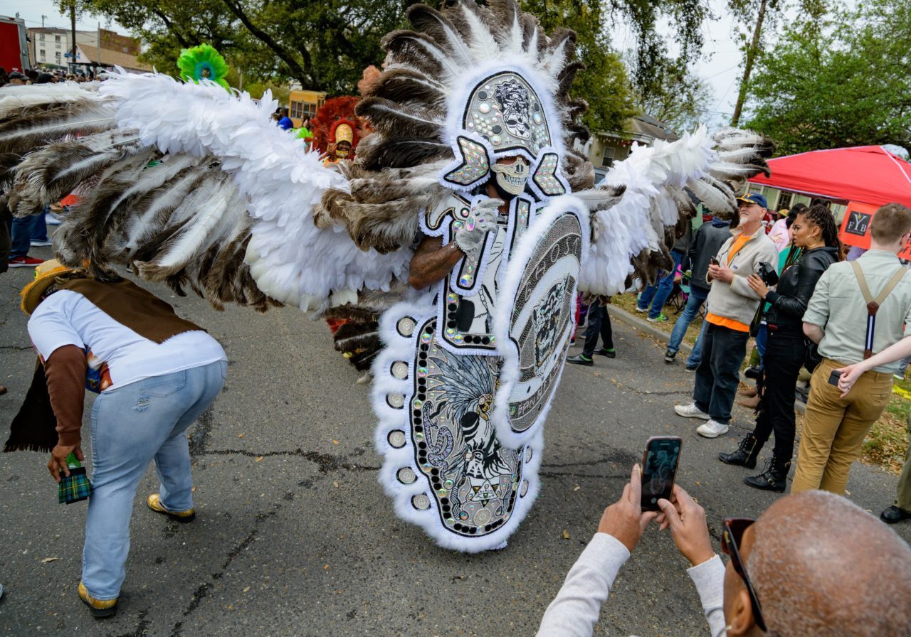 Steve Austin, the Ghost Gang Flag of the Black Mohawk Mardi Gras Indians, has a wing span of more than a car length on Super Sunday, March 17, 2019, in New Orleans, La. Photo by Matthew Hinton