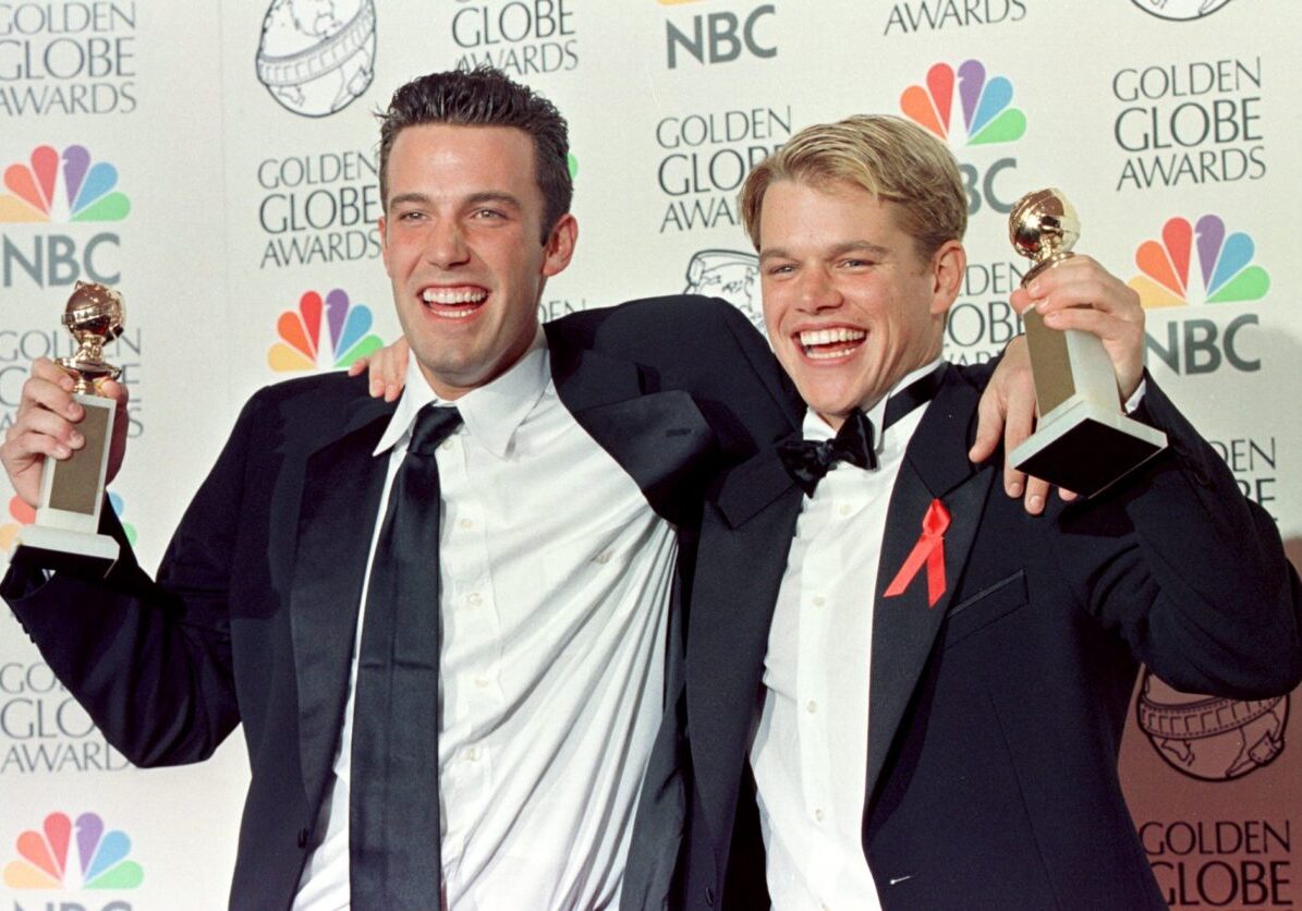 BEVERLY HILLS, CA - JANUARY 18:  Actor Matt Damon (R) and co-writer Ben Affleck (L)  pose with their Golden Globe award for Best Screenplay for "Good Will Hunting" at the 55th Annual Golden Globe Awards at the Beverly Hilton 18 January in Beverly Hills, CA.  Damon, who also stars in the movie, is nominated for a Best Actor award in the drama category. AFP PHOTO    Hal GARB/mn  (Photo credit should read HAL GARB/AFP via Getty Images)