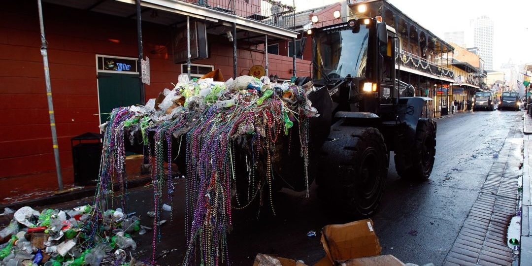 NEW ORLEANS - FEBRUARY 24:  Heavy construction equipment picks up trash from the night before to prepare for Mardi Gras day in the French Quarter on February 24, 2009 in New Orleans, Louisiana. The yearly celebration officially ends Tuesday at midnight.  (Photo by Chris Graythen/Getty Images)