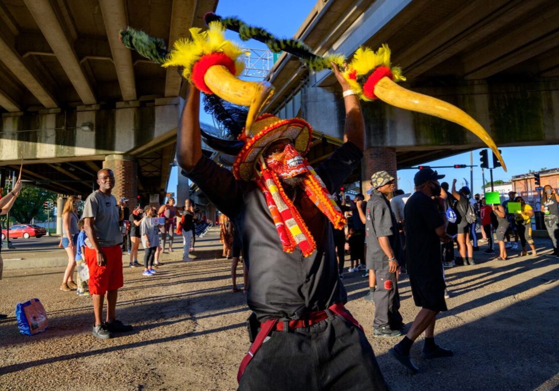 Wearing all black instead of suits, members of the Black Hawk Hunters Mardi Gras Indians take part in a “Peaceful Demonstration for the Young Black Generation,” in the Treme / Lafitte neighborhoods and the 7th Ward in New Orleans Friday June 12, 2020. The Black Hawk Hunters represent the Young Indians of the Nation and are led by Big Chief Terrance “Tee” Williams, age 16.  In promoting the demonstration Williams said “I am the future. I am not a threat.” The group asked people to come out and support the youth and to wear masks to protect against COVID-19. They were joined by members of the Golden Blades, Bo Dollis, Jr. and the Wild Magnolias, Big Chief Dow Edwards, and 9th Ward Black Hatchet Wildman Chuck Walkanela. The rally ended at the NORDC Hunter’s Field at St. Bernard Ave. The New Orleans Recreation Department Commission location was run for many years by Jerome Smith, a Freedom Rider, who also helped start the first Super Sunday celebration for the Mardi Gras Indians.