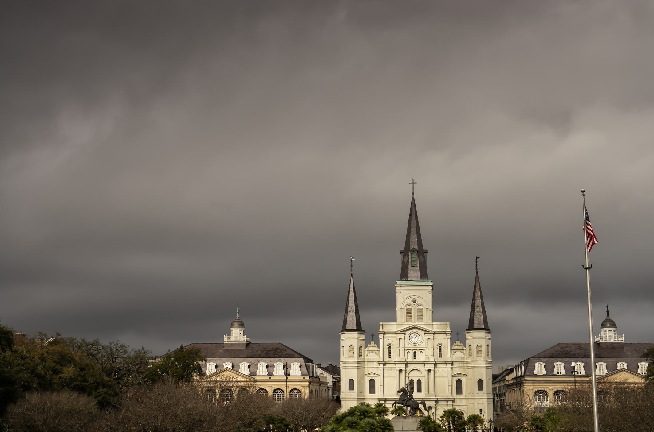 February 2020 Dark storm clouds linger over Jackson square in New Orleans weeks before coronavirus outbreak hits the city.