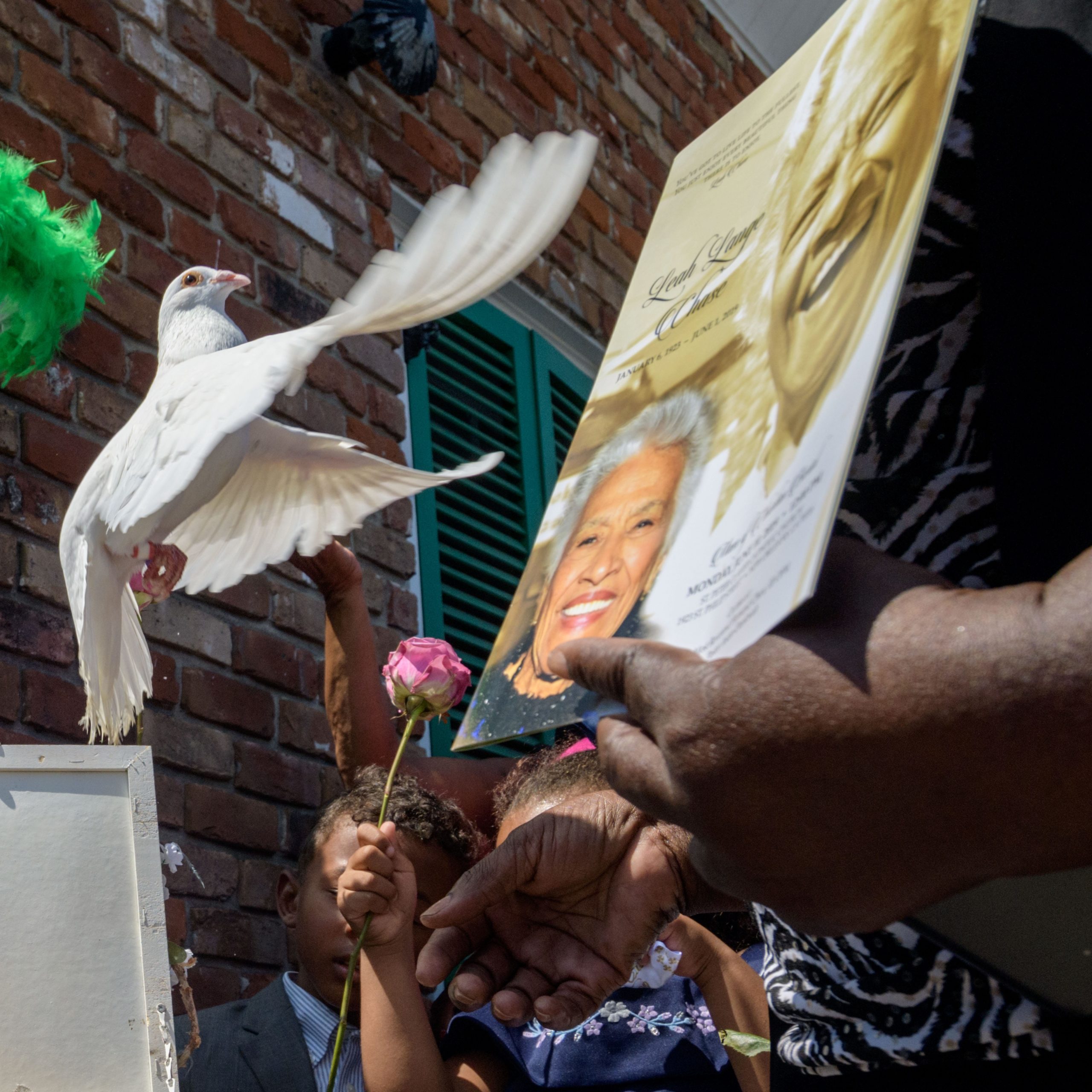 Clarence Dalcour, Chief of the Creole Oceolas Mardi Gras Indians, releases doves at Dooky Chase's Restaurant in remembrance of Chef Leah Chase as family members of Chase look on after a funeral mass in the Treme neighborhood in New Orleans, La. Monday, June 10, 2019. The Queen of Creole Cuisine at Dooky Chase's Restaurant passed away last Saturday June 1st at the age of 96. Born on January 6, 1923 she later served two U.S. presidents and also Freedom Riders during the Civil Rights era.  The restaurant she ran with her husband, Dooky Chase, Jr., served as a meeting place for African-American politicians for decades.  Photo by Matthew Hinton