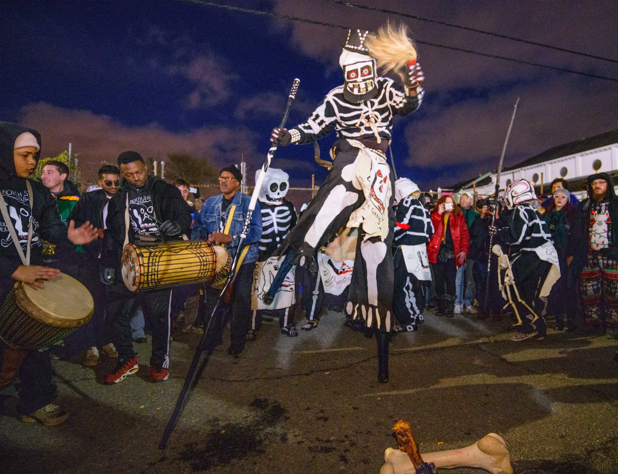 The North Side Skull and Bones Gang wakes up revelers on Mardi Gras morning in New Orleans, La., March 5, 2019. The group is celebrating its 200th anniversary as the oldest Mardi Gras Black Indian Gang or Tribe in America, with an African Creole tradition dating back to 1819. The gang members were descendants of slaves and Native Americans. Skull and Bones are meant to remind people of their mortality and to live a moral life to avoid becoming Skull and Bones themselves. Photo by Matthew Hinton