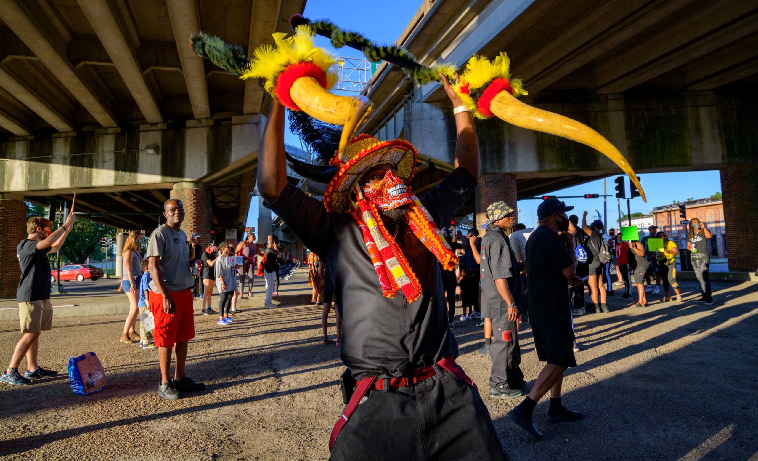 Wearing all black instead of suits, members of the Black Hawk Hunters Mardi Gras Indians take part in a “Peaceful Demonstration for the Young Black Generation,” in the Treme / Lafitte neighborhoods and the 7th Ward in New Orleans Friday June 12, 2020. The Black Hawk Hunters represent the Young Indians of the Nation and are led by Big Chief Terrance “Tee” Williams, age 16.  In promoting the demonstration Williams said “I am the future. I am not a threat.” The group asked people to come out and support the youth and to wear masks to protect against COVID-19. They were joined by members of the Golden Blades, Bo Dollis, Jr. and the Wild Magnolias, Big Chief Dow Edwards, and 9th Ward Black Hatchet Wildman Chuck Walkanela. The rally ended at the NORDC Hunter’s Field at St. Bernard Ave. The New Orleans Recreation Department Commission location was run for many years by Jerome Smith, a Freedom Rider, who also helped start the first Super Sunday celebration for the Mardi Gras Indians.