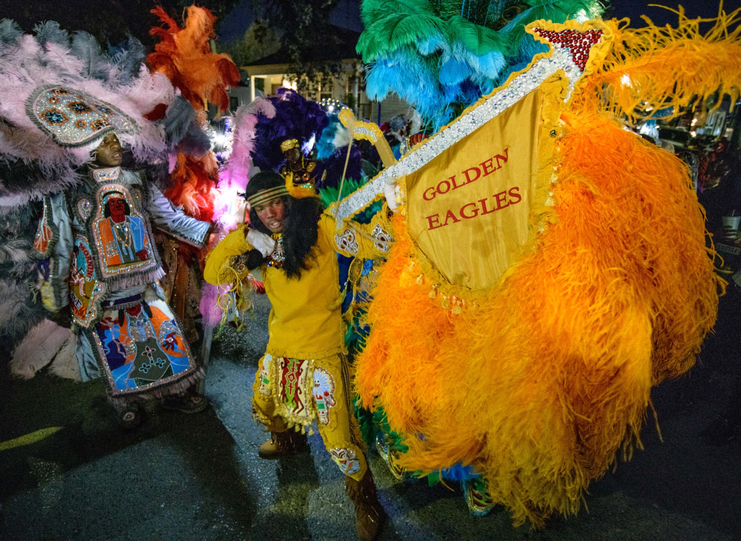 Mardi Gras Indians including the Golden Eagles come out on St. Joseph's Night on Washington Ave. near A. L. Davis Park in New Orleans, La. Tuesday, March 19, 2019. Photo by Matthew Hinton