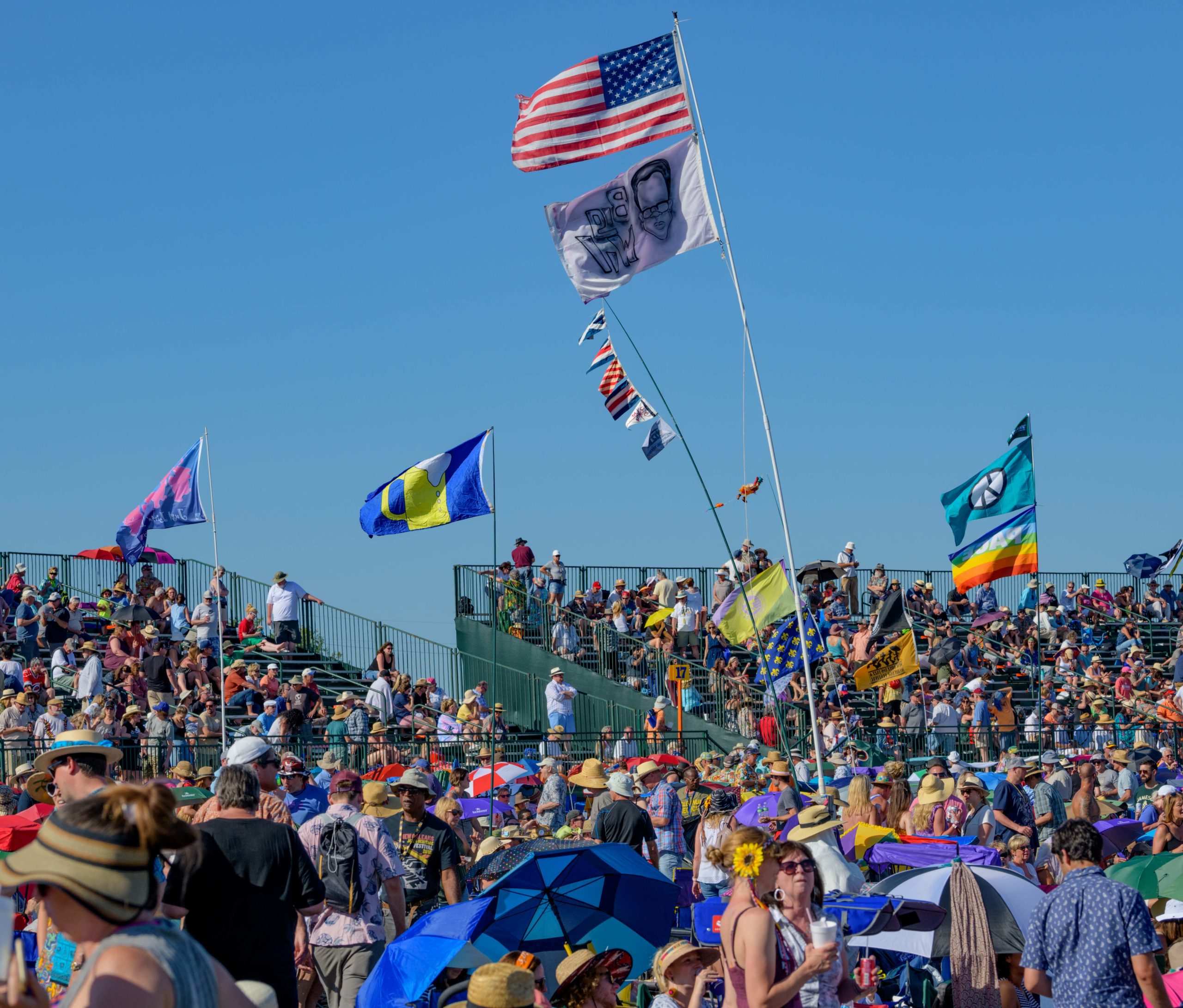 A crowd watches at the Acura Stage infield at the 50th New Orleans Jazz and Heritage Festival at the Fair Grounds in New Orleans, La. Sunday, April 28, 2019. Photo by Matthew Hinton