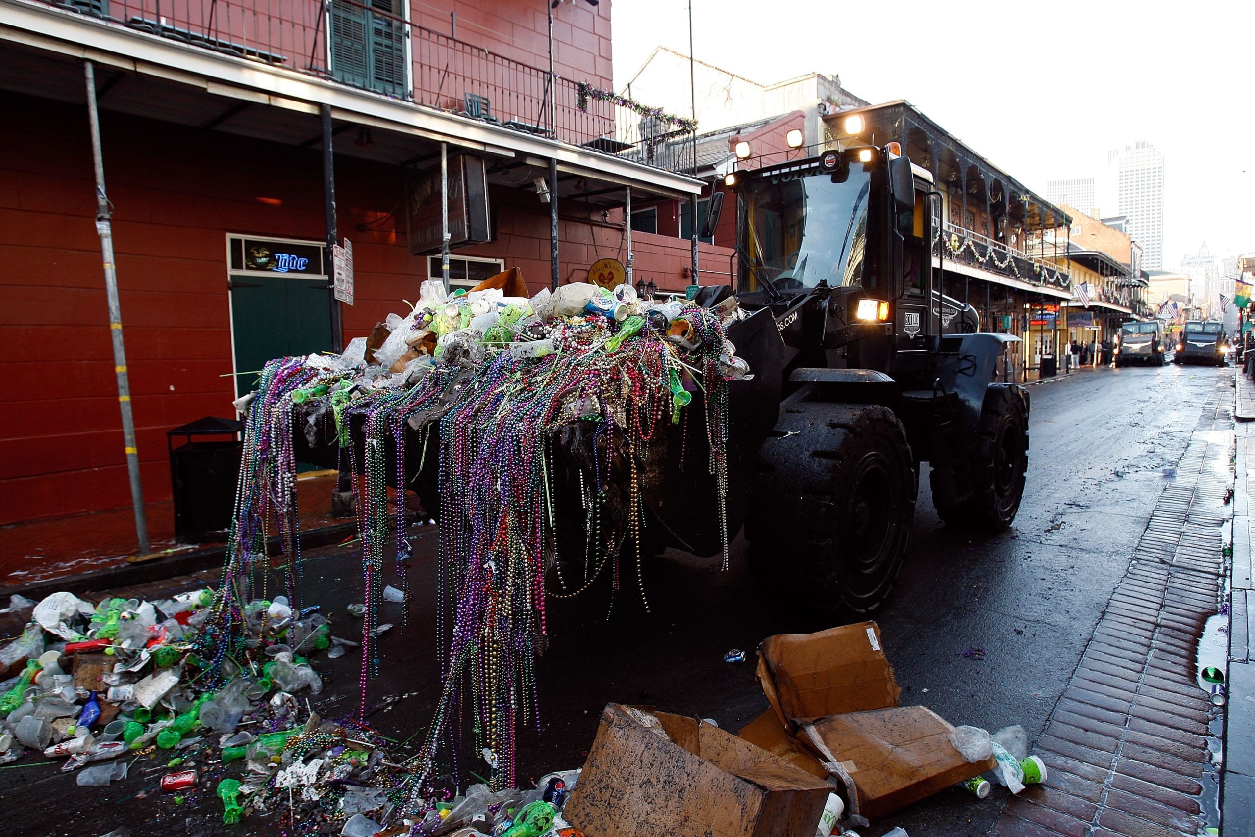 NEW ORLEANS - FEBRUARY 24:  Heavy construction equipment picks up trash from the night before to prepare for Mardi Gras day in the French Quarter on February 24, 2009 in New Orleans, Louisiana. The yearly celebration officially ends Tuesday at midnight.  (Photo by Chris Graythen/Getty Images)