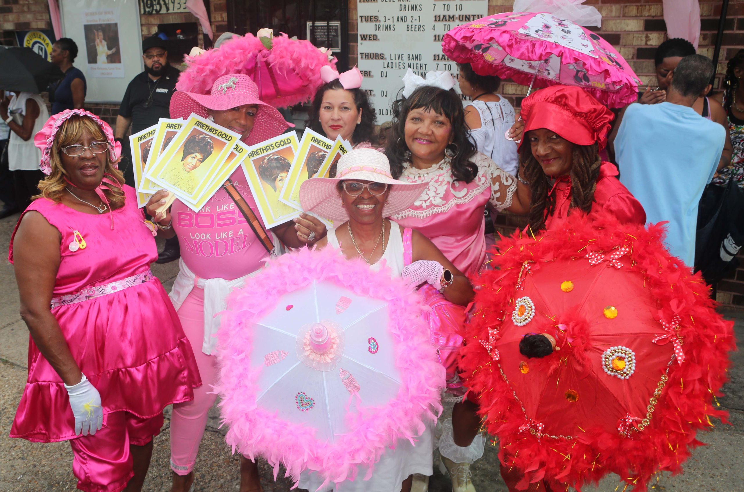 A group of performers all pose during a second line parade for the late singer Aretha Franklin at the Joker's Wyld and Mickey's Playhouse Lounge in New Orleans on Monday, August 20, 2018.  (Photo by Peter G. Forest)