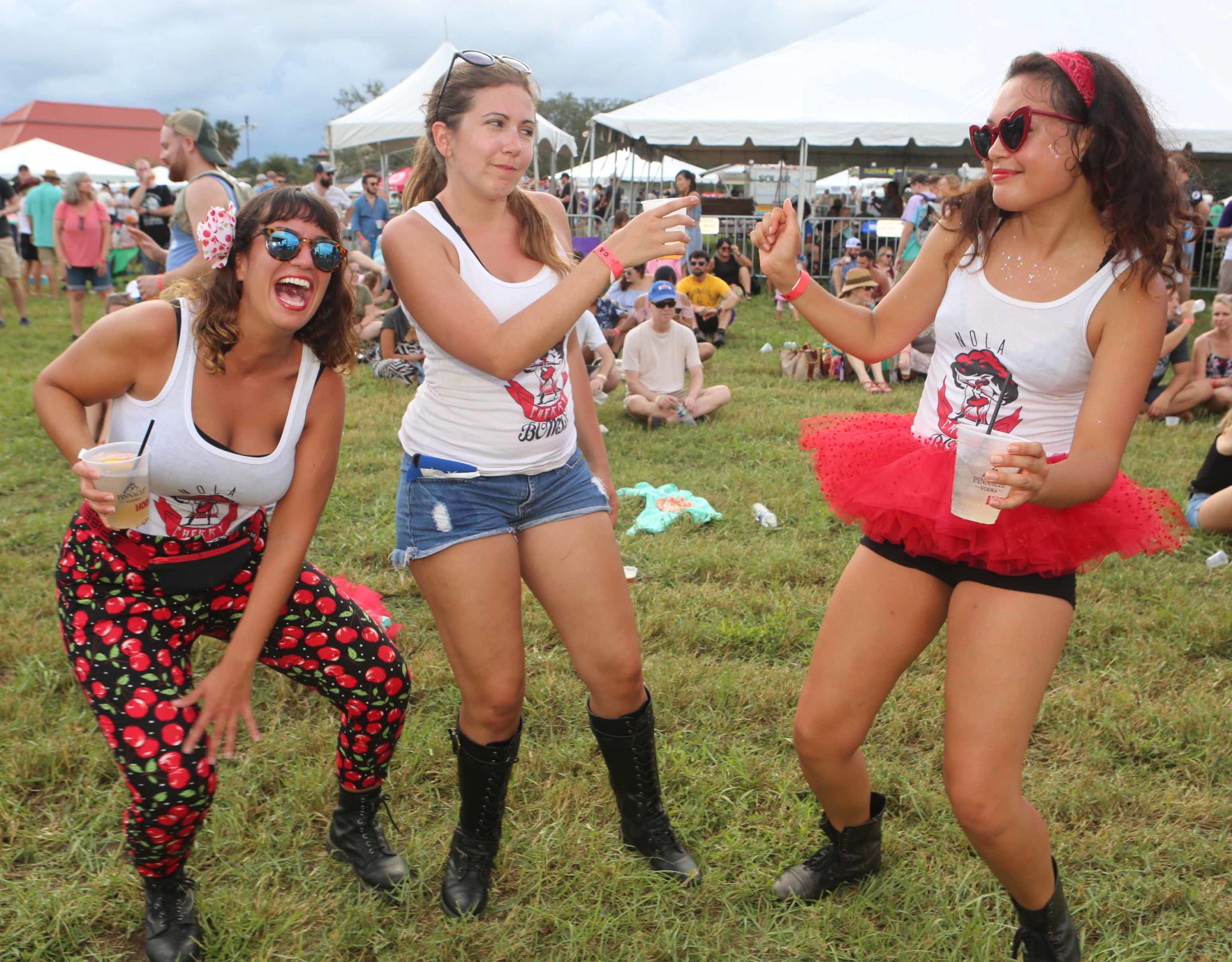 NOLA Cherry Bombs Liz DeVito, Marina McGarth and Athena Turek all dance to the sounds of the band Givers during the 9th Annual NOLA on Tap Beer Festival at City Park in New Orleans on Saturday, September 22, 2018.  (Photo by Peter G. Forest)  Instagram:  @forestphoto_llc