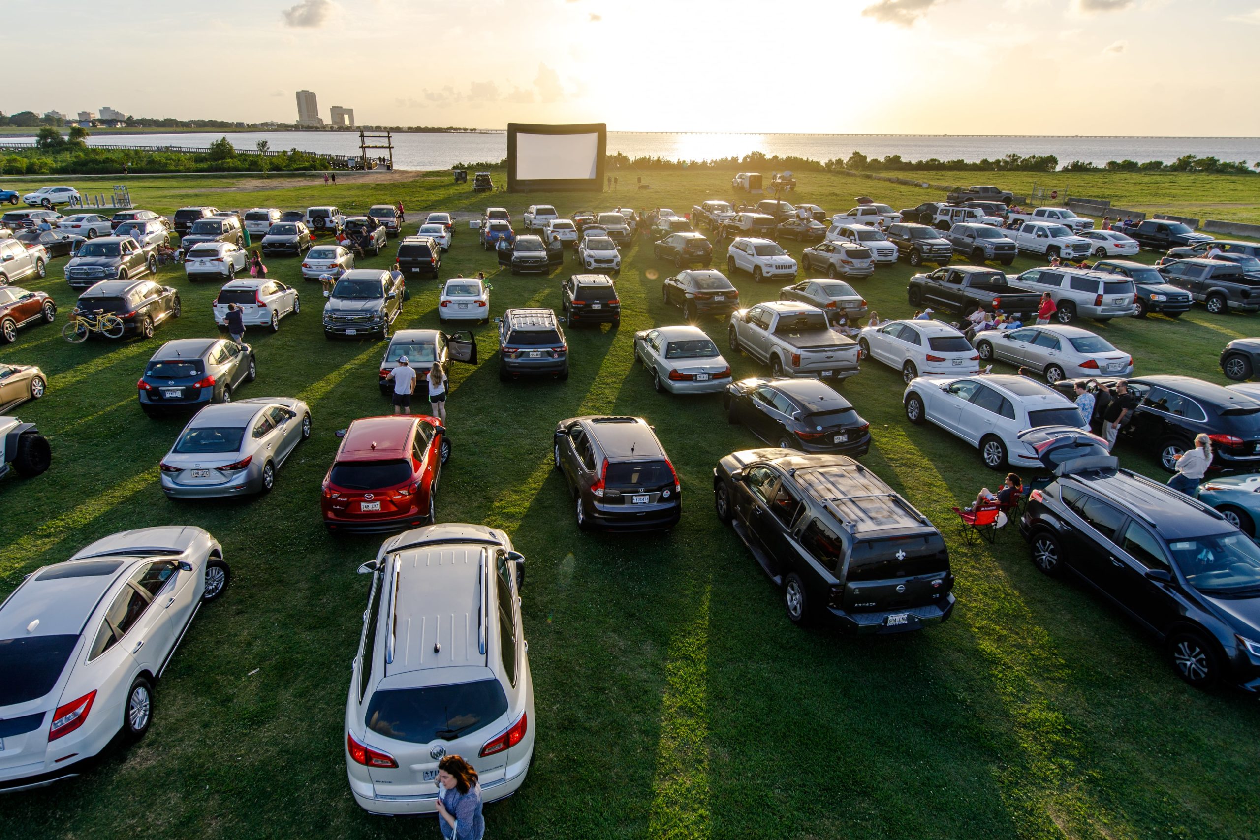 METAIRIE, LOUISIANA - MAY 22: Attendees arrive to watch the movie "Grease" at a pop-up drive-in theatre at Bucktown Marina Park on May 22, 2020 in Metairie, Louisiana. With indoor theaters in many places still closed due to coronavirus, drive-in theaters have seen a rise in attendance. (Photo by Josh Brasted/Getty Images)
