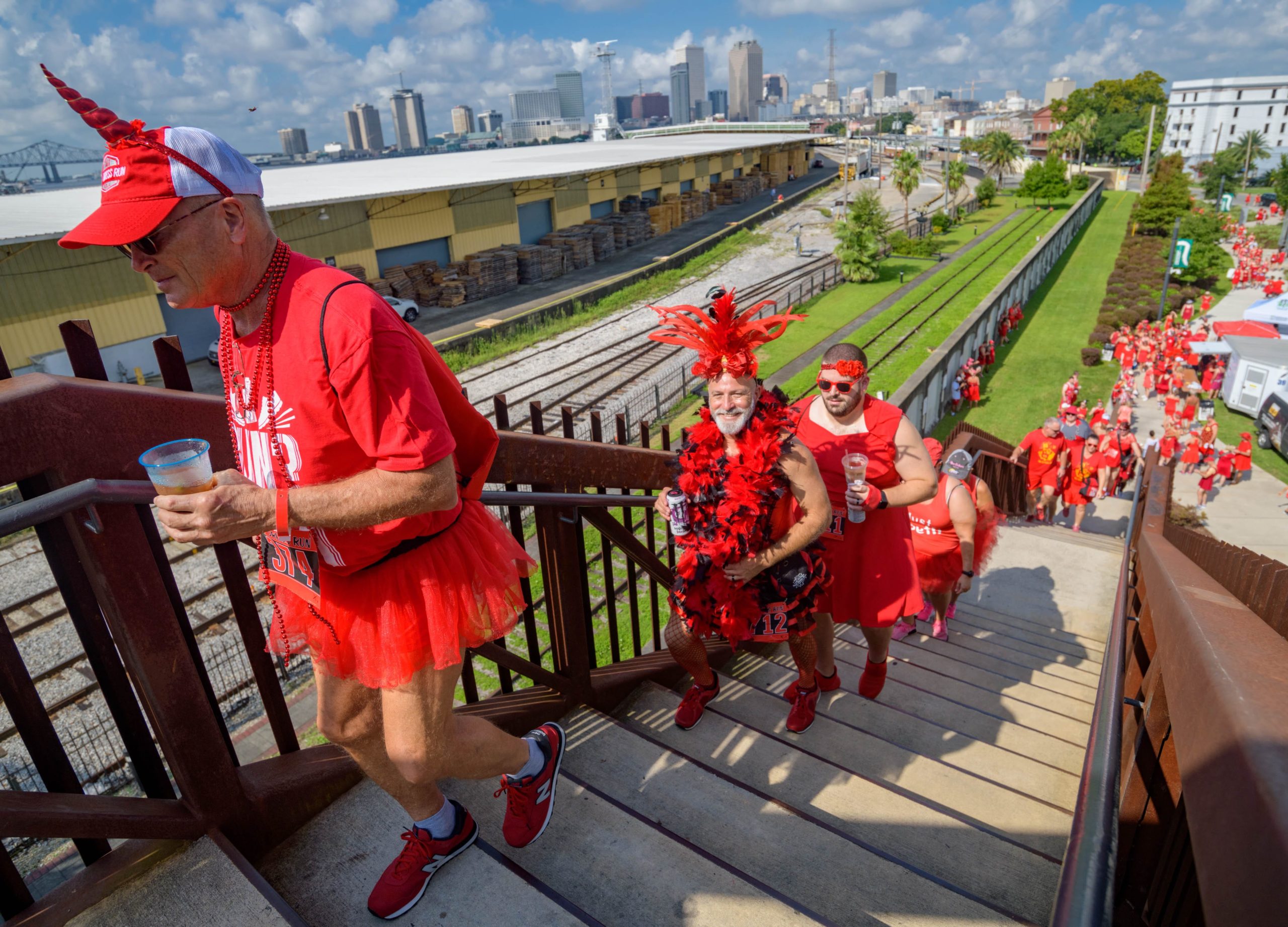 Runners take part 25th annual New Orleans Red Dress Run that is put on by the Hash House Harriers who call their group A Drinking Club with a Running Problem in New Orleans, La. Saturday, Aug. 10, 2019. The annual event also raises money for charities awarding over $1 million in grants over the years. Most people dont run and instead hang out in the French Quarter. Photo by Matthew Hinton