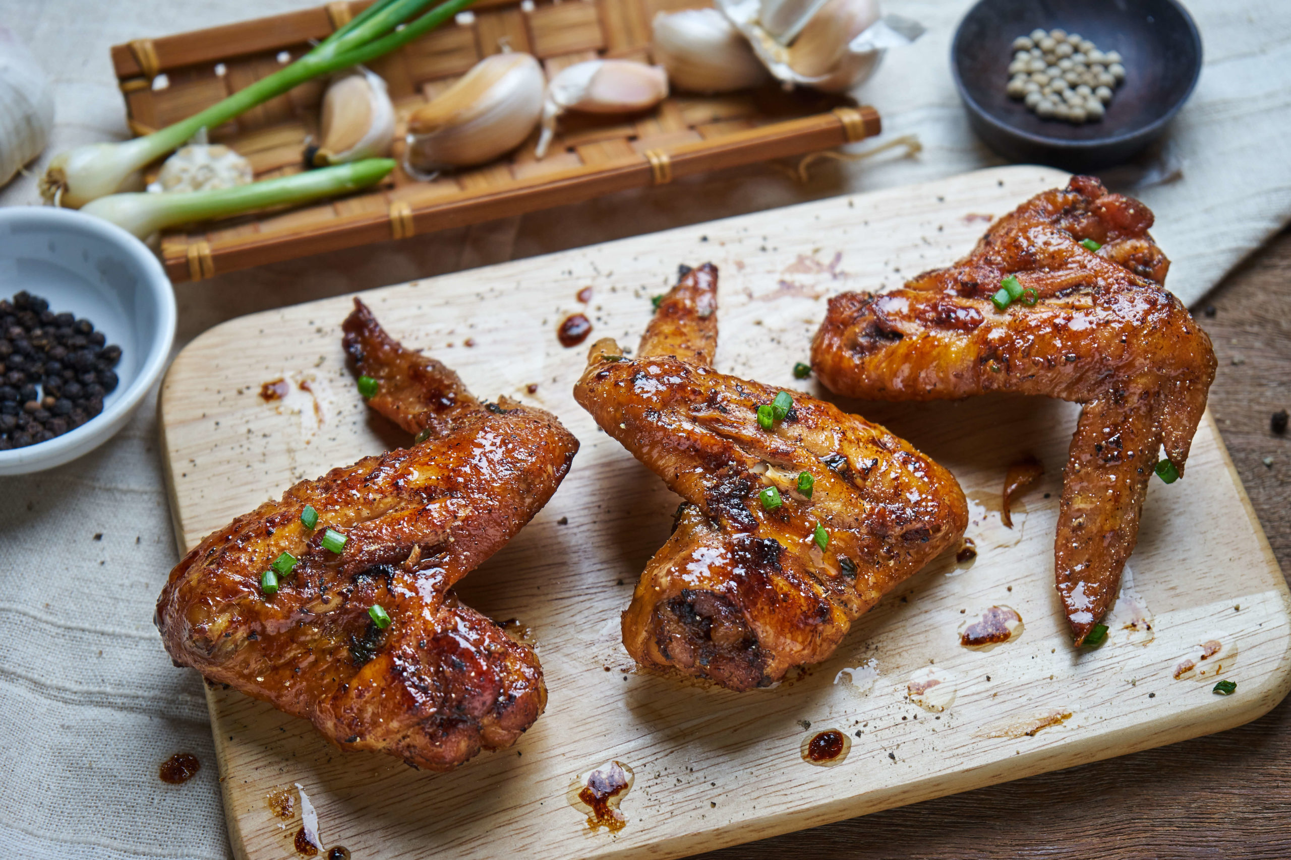 High Angle View Of Fried Chicken Wings On Cutting Board Over Able