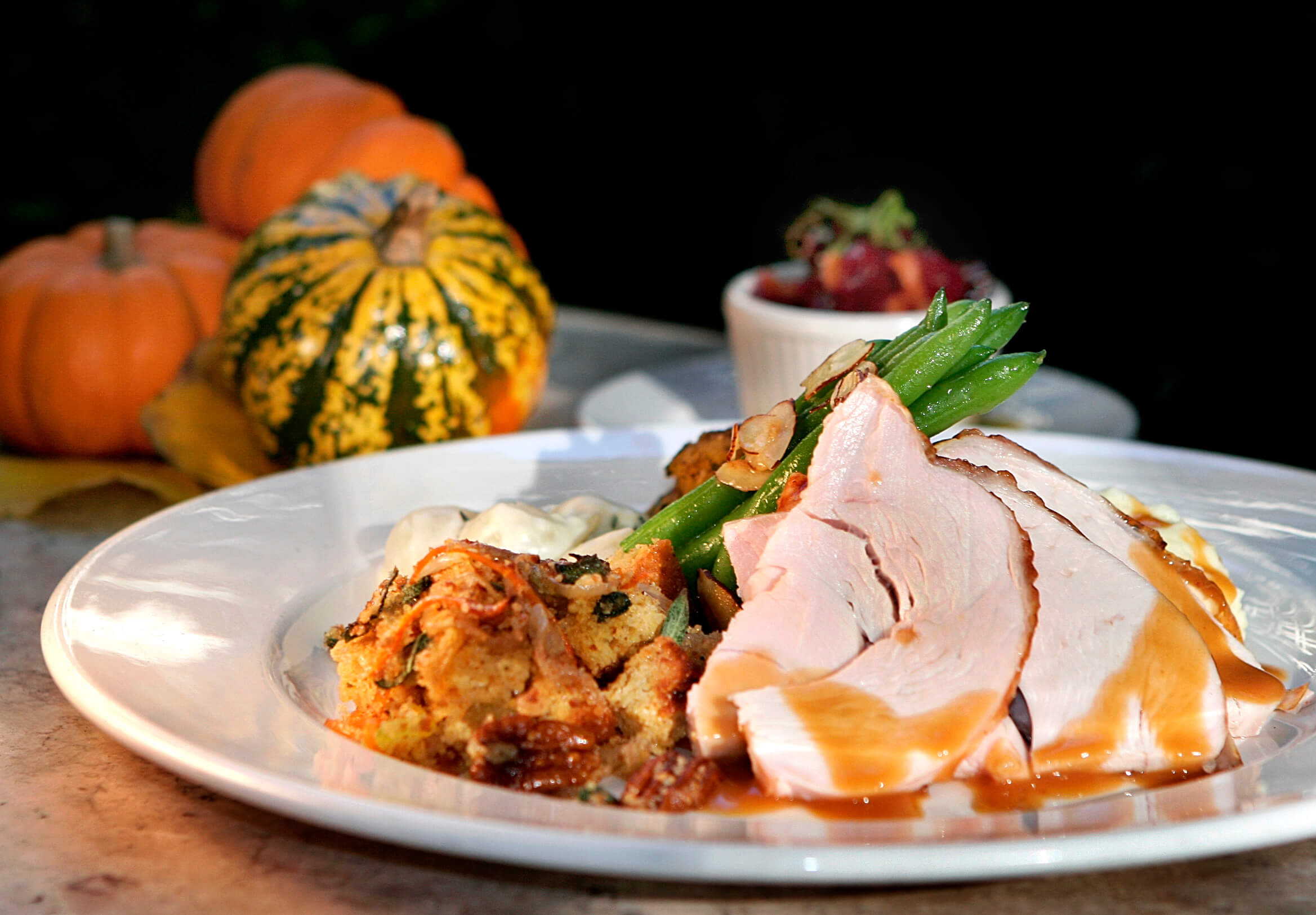 CAMBRIDGE, MA - NOVEMBER 2: Roasted turkey breast with cornbread and candied pecan stuffing, creamed onions, gratine of acorn squash, green beans alamadine and cranberry chutney is served during Thanksgiving at the Harvest in Cambridge, Wednesday, Nov. 2, 2005. (Photo by Wendy Maeda/The Boston Globe via Getty Images)