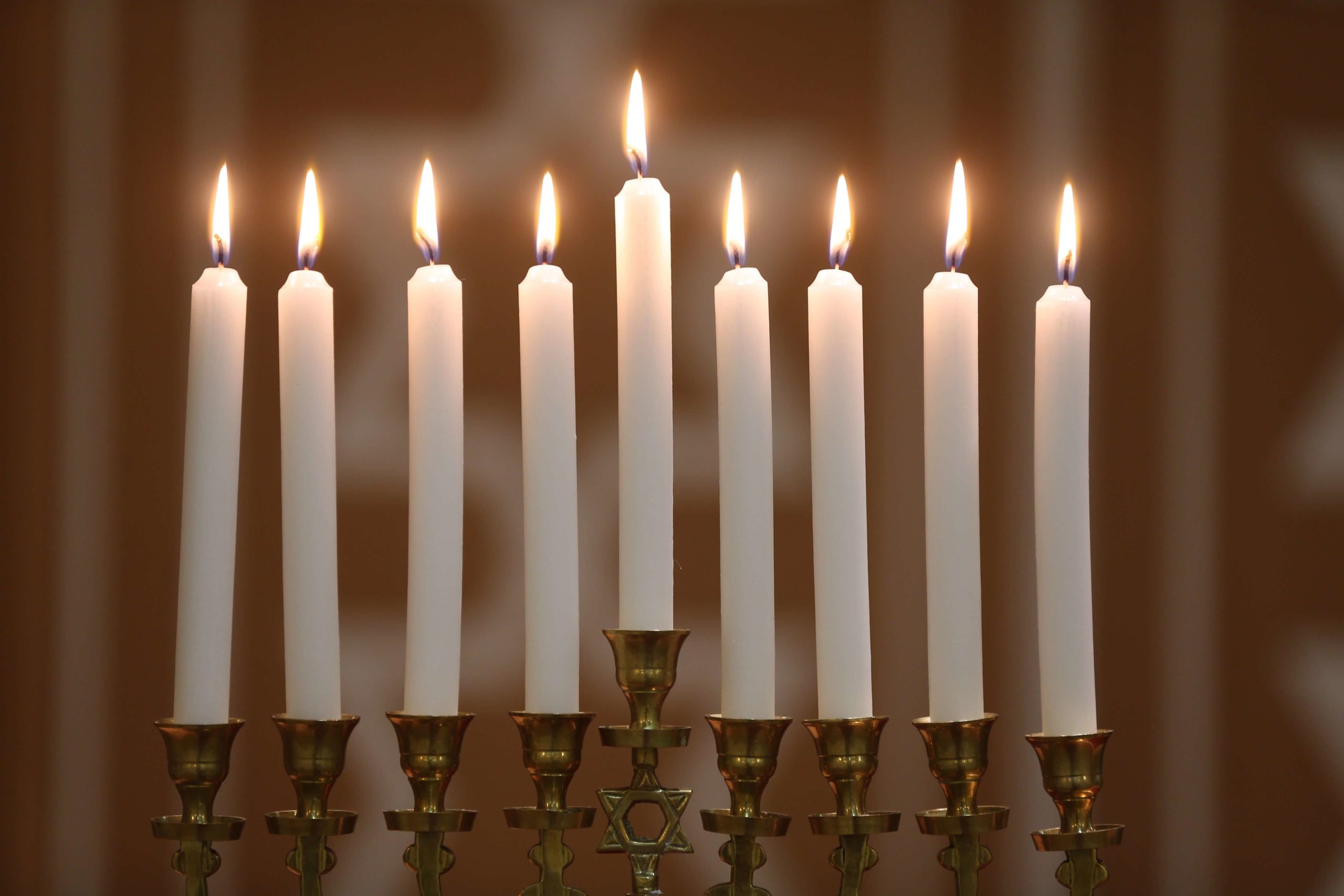 Hanukkha with nine lit candles. (Photo by: Godong/UIG via Getty Images)