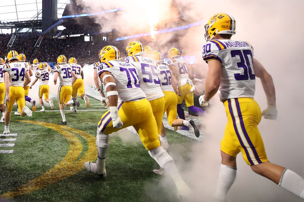 ATLANTA, GEORGIA - DECEMBER 28: The LSU Tigers take the field to play the Oklahoma Sooners in the College Football Playoff Semifinal in the Chick-fil-A Peach Bowl at Mercedes-Benz Stadium on December 28, 2019 in Atlanta, Georgia. (Photo by Gregory Shamus/Getty Images)