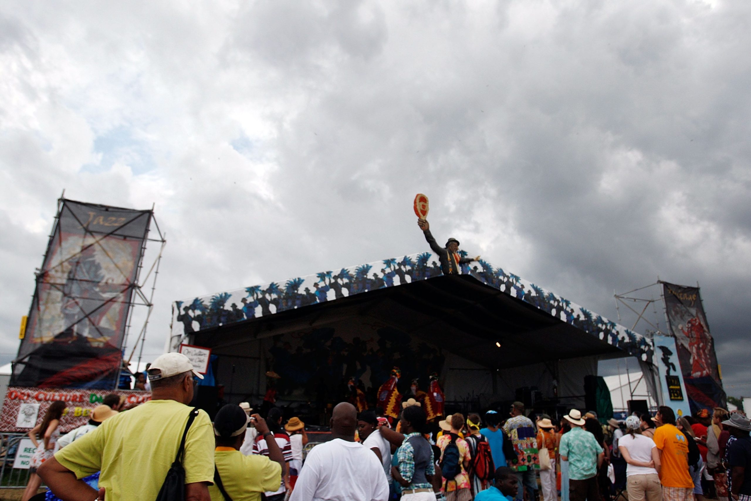 NEW ORLEANS - MAY 03:  Fans watch as rain clouds gather over the Jazz and Heritage festival in the 2009 New Orleans Jazz &amp; Heritage Festival at the Fair Grounds Race Course on May 3, 2009 in New Orleans.  (Photo by Chris Graythen/Getty Images)