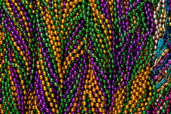 Full frame image of Mardi Gras beads.