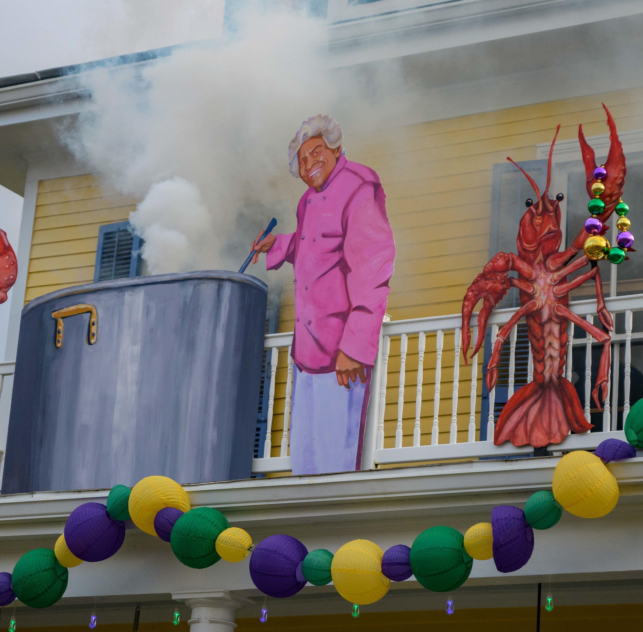 The house at 2918 Bell Street celebrates Chef Leah Chase complete with a smoke machine to simulate her cooking a big pot of gumbo in the Bayou St. John neighborhood in New Orleans, Sunday, Jan. 24, 2021. The house float is home to Mark Douce, his wife Alistair Johnson, and their son Sawyer Douce. The float is part of a theme for the street called “Belles of the Bayou,” celebrating important women in New Orleans history. Other homes on the street celebrate Voodoo practitioner Marie Laveau, singer Mahalia Jackson, and Baroness Pontalba, with others to feature performer Chris Owens and author Anne Rice. The porch decorations were created by the Stronghold Studios, a New Orleans entertainment display prop company, with Douce creating the smoke. Photo by @MattHintonPhoto for @VeryLocalNOLA

#ChefLeahChase #LeahChase #BellesoftheBayou #YardiGras #KreweofHouseFloats @strongholdstudiosnola #MardiGras2021 #MardiGras #VLNOLAMardiGras #Carnival #neworleanslouisiana #nolalife #herenowlouisiana #gonola #onetimeinnola #itsyournola #showmeyournola #nola #followyournola #exploreneworleans #ilovenola #VLNOLA @kreweofhousefloats #Housefloat #porchfloat @dookychaseresteraunt