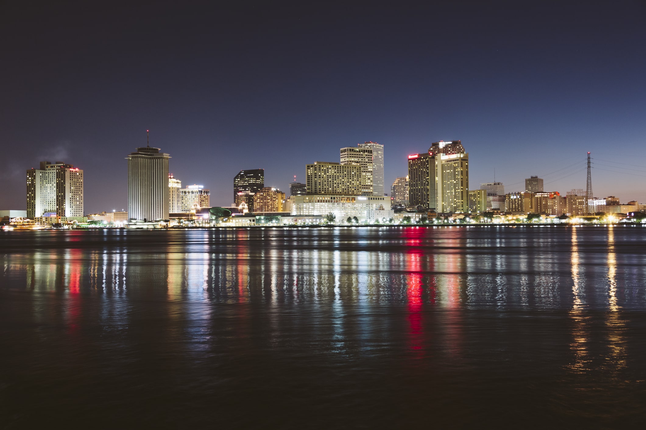USA, New Orleans, Downtown reflected in the Mississippi river at night