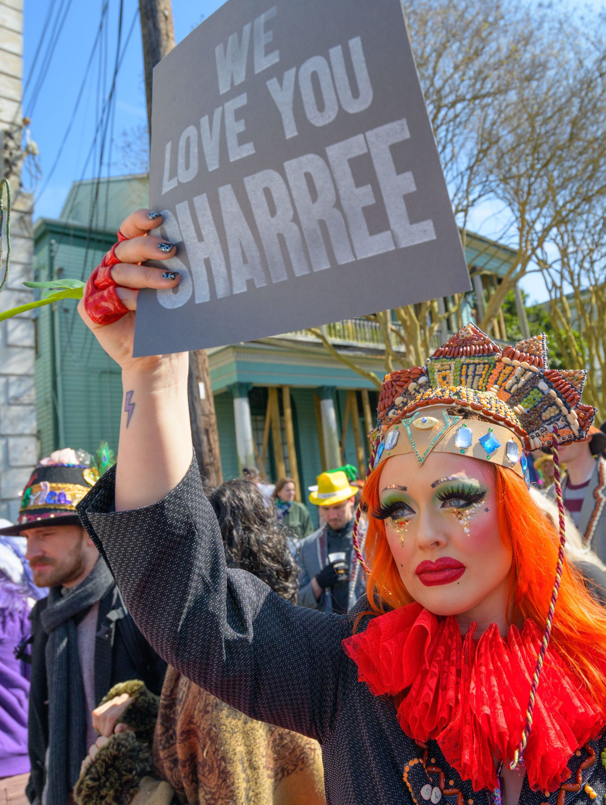 The Krewe of Red Beans paraded through the Marigny on Lundi Gras in New Orleans, La. Monday, March 4, 2019. Many of the Krewe honored Sharree Walls, 27, who was a member of the Krewe and was killed by a suspected drunk driver on Saturday after the Endymion parade.  Photo by Matthew Hinton