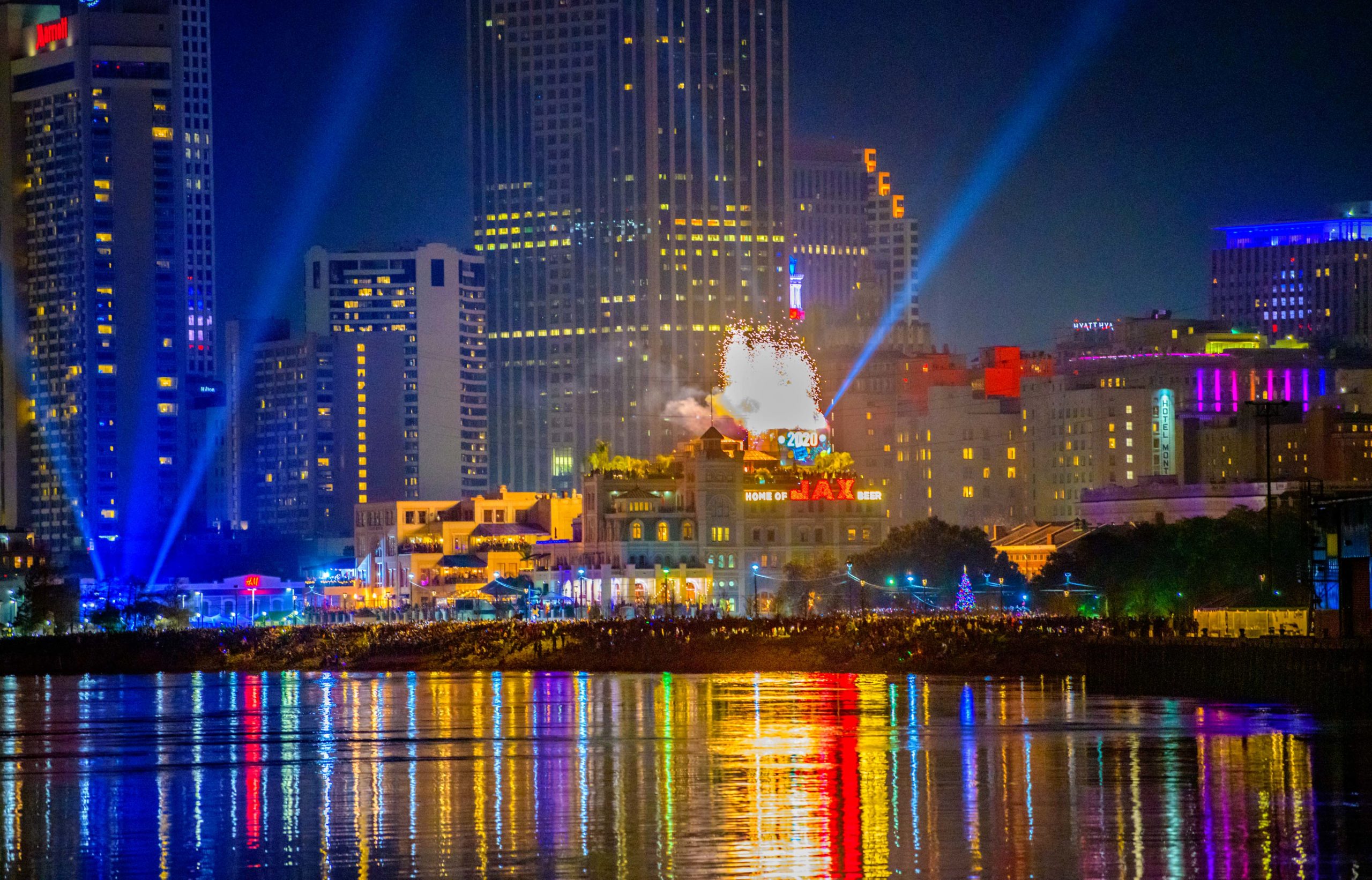 A lighted Fleur-de-Lis drops on top of Jax Brewery in the French Quarter to signify the end of the year in New Orleans as New Orleanians enjoy the fireworks at midnight on New Years Day 2020 on the Mississippi River. Photo by Matthew Hinton