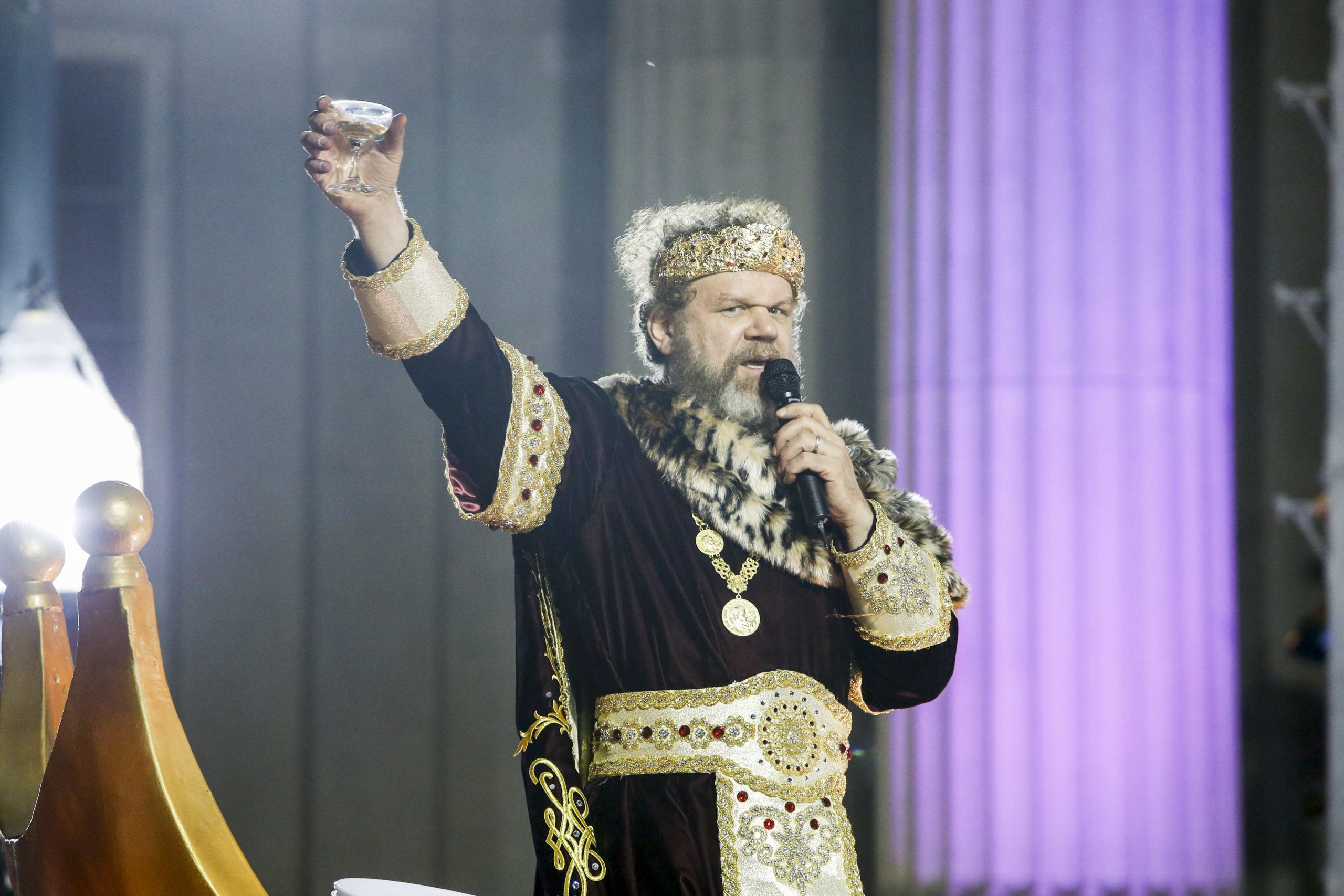 NEW ORLEANS, LA - FEBRUARY 15: Actor John C. Reilly holds up a glass of champagne to toast as he reigns as Bacchus XLVI in the Krewe of Bacchus parade during Mardi Gras on February 15, 2015 in New Orleans, Louisiana. (Photo by Skip Bolen/WireImage)