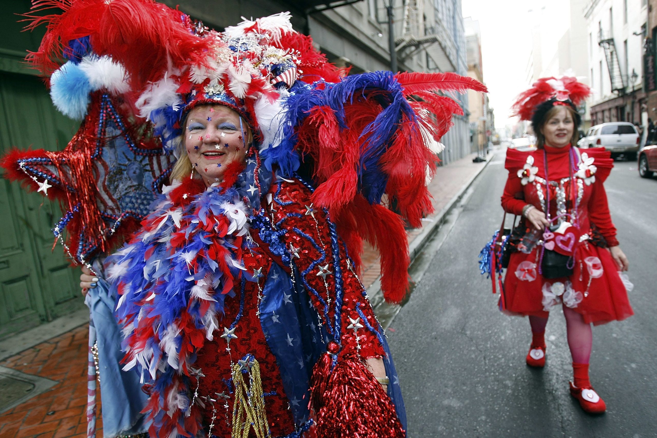 NEW ORLEANS - FEBRUARY 20:  Barbara Rabb (L) of Mississipi, dressed as the Fourth of July, walks through the French Quarter on Mardi Gras Day, February 20, 2007 in New Orleans, Louisiana. This is the second Mardi Gras celebration since Hurricane Katrina devasted the Gulf Coast region.  (Photo by Chris Graythen/Getty Images)