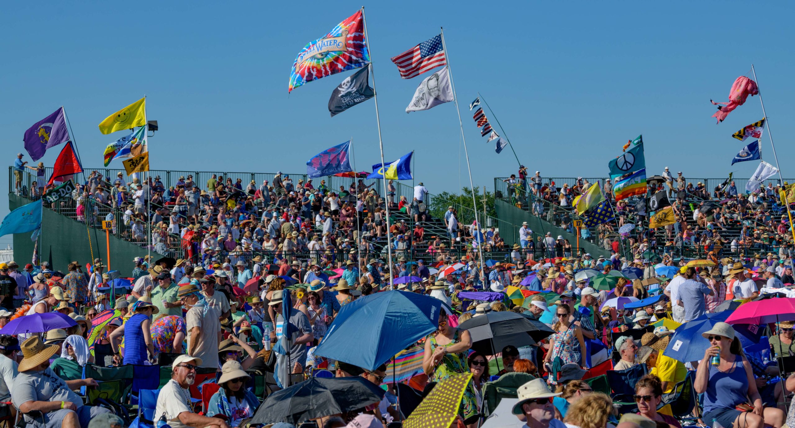 A crowd watches at the Acura Stage infield at the 50th New Orleans Jazz and Heritage Festival at the Fair Grounds in New Orleans, La. Sunday, April 28, 2019. Photo by Matthew Hinton