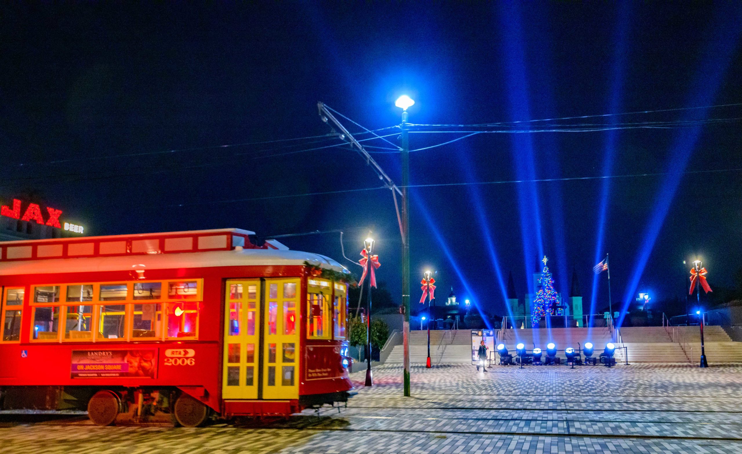 #LunaFete2020 : In celebration of seven years of Luna Fete, seven pillars of light are seen on the Moonwalk in the French Quarter, Friday, December 18, 2020. Due to the COVID-19 pandemic Luna Fete spread out its light displays across the city this year to avoid crowds and maintain social distancing.  According to the Luna Fete website the Skylights installation “honors the history of light festivals, created to combat feelings of isolation and loneliness in the dark winter months. . .light provides a source of hope in the and healing for the future. We encourage you to keep your head up and watch the darkness fade.” Other installations unique to the second weekend include the Chemin Du Bayou directed by Pamela Davis-Noland to celebrate Bayou Road in New Orleans with projections on the Southern Rep Theatre, the former St. Rose de Lima Church. The projection runs 6-10pm nightly through Dec 20th. A third project called Messages of Hope displays words on The Circle, at St. Charles and Howard Ave. “The artwork seeks to unify the New Orleans community with words that demonstrate the power of the human spirit, equity, and inclusion. The New Orleans Jazz Museum was lit green for #LIGHTITGREEN in support of Luna Fete as green is a color of hope and new beginnings. Many of the displays this year are visible along the Lafitte Greenway for the Supernova on the Greenway in conjunction with Luna Fete. Photos by @MattHintonPhoto for @VeryLocalNOLA #LunaFete #artscouncilofneworleans #VLNola #HappyHolidays #NewOrleans #mycrescentcity #neworleanslouisiana #nolalife #herenowlouisiana #gonola #onetimeinnola #itsyournola #showmeyournola #nola #followyournola #exploreneworleans #ilovenola  #greenwaysupernova #FrenchQuarter #AlgiersPoint #StLouisCathedral #Streetcar #NewOrleansStreetcar 