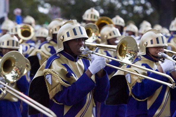 NEW ORLEANS - FEBRUARY 3: Purple is the color of royalty, and in New Orleans the St. Augustine High School marching band, the Purple Knights, are the kings of Mardi Gras as they lead the Krewe of Bacchus Mardi Gras parade on Tchopitulous Street February 3, 2008 in New Orleans, the weekend before Fat Tuesday, February 5. The Krewe of Bacchus Mardi Gras parade is one of the biggest and flashiest of all New Orleans' Mardi Gras parades. (Photo by Skip Bolen/WireImage) *** Local Caption ***