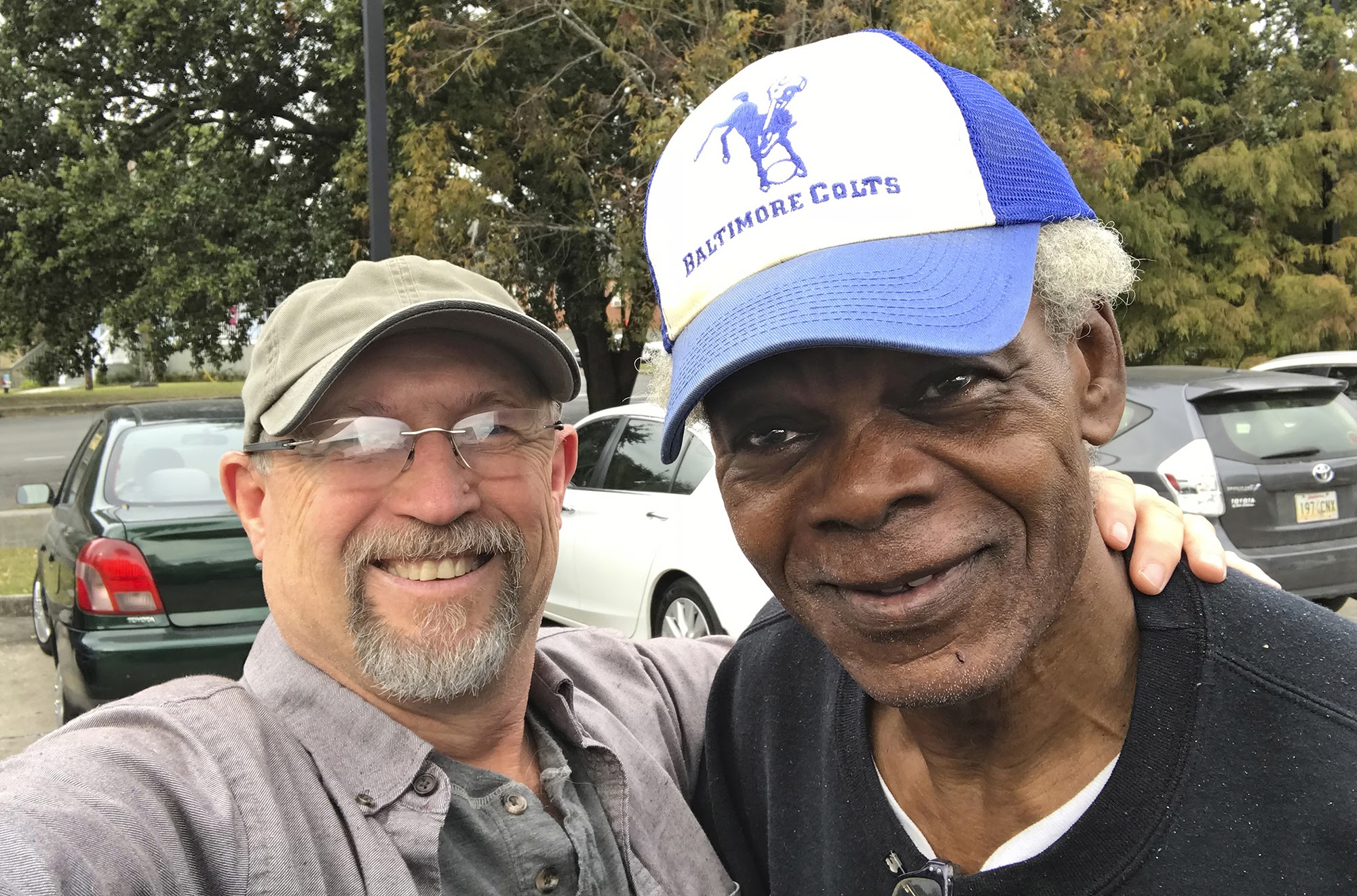 Ted Jackson and Jackie Wallace share a reunion moment in New Orleans, Monday, Nov. 21 2019 with a Baltimore Colts cap, circa 1976, a kind gift from an Alcoholics Anonymous friend in Baltimore. 
Photo by Ted Jackson