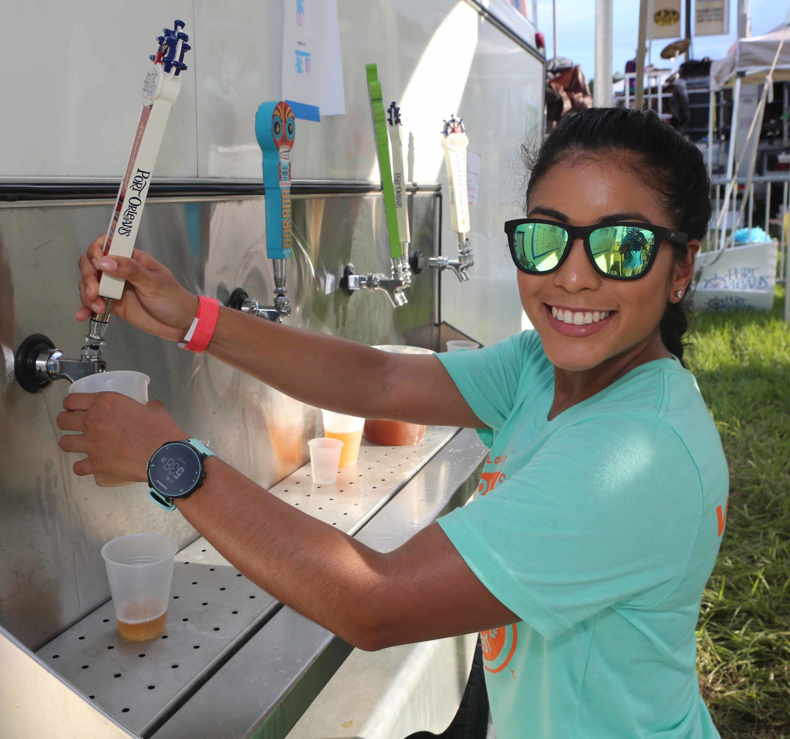 Stephanie Murillo pour some Port Orleans Riverfront Lager during the 9th Annual NOLA on Tap Beer Festival at City Park in New Orleans on Saturday, September 22, 2018.  (Photo by Peter G. Forest)  Instagram:  @forestphoto_llc