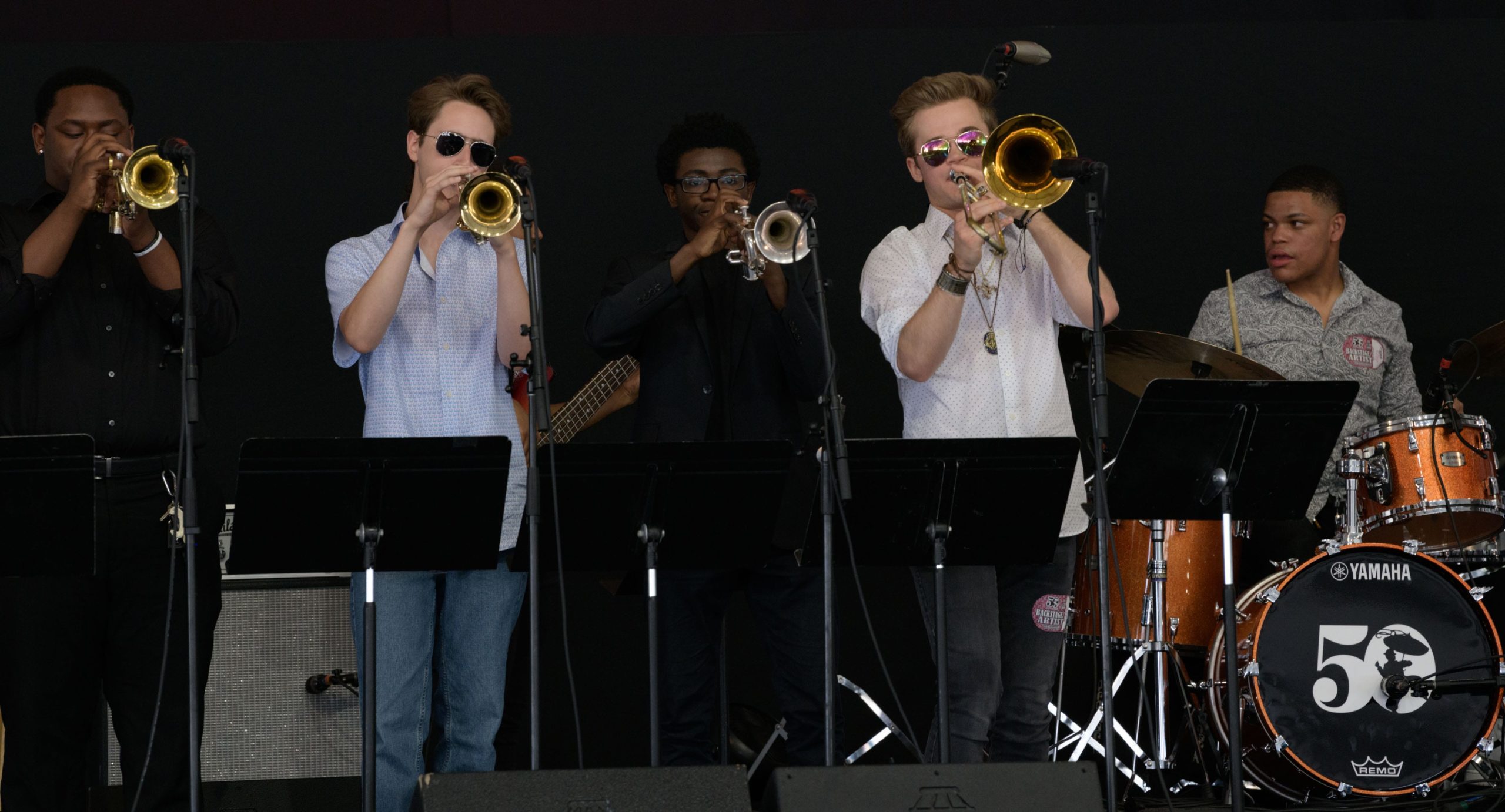 The New Orleans Center for Creative Arts (NOCCA) Jazz Ensemble performs in the WWOZ Jazz Tent during the 50th New Orleans Jazz and Heritage Festival at the Fair Grounds in New Orleans, La. Sunday, April 28, 2019. Photo by Matthew Hinton