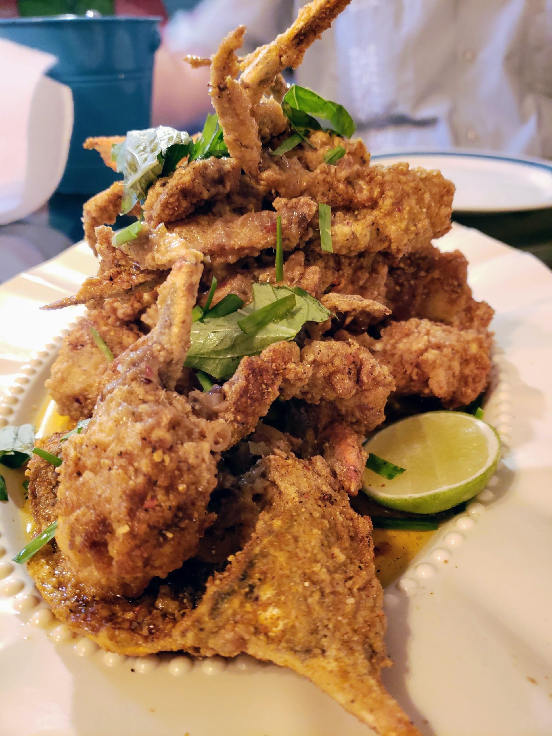 Marjie's Chili Butter Hard Crabs - boiled Louisiana blue crabs, dredged
 in batter, fried, doused in a sharp, rich chili butter and given a fall of torn herbs and chives - are otherworldly. (Photo by Lorin Gaudin, Very Local New Orleans)
