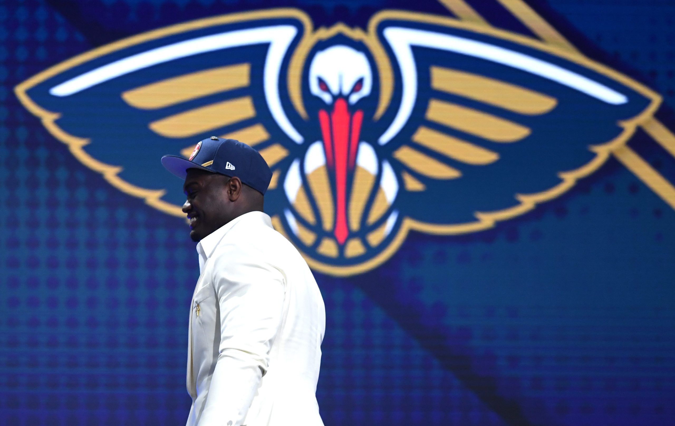 NEW YORK, NEW YORK - JUNE 20: Zion Williamson walks to the stage after being drafted with the first overall pick by the New Orleans Pelicans during the 2019 NBA Draft at the Barclays Center on June 20, 2019 in the Brooklyn borough of New York City. NOTE TO USER: User expressly acknowledges and agrees that, by downloading and or using this photograph, User is consenting to the terms and conditions of the Getty Images License Agreement. (Photo by Sarah Stier/Getty Images)