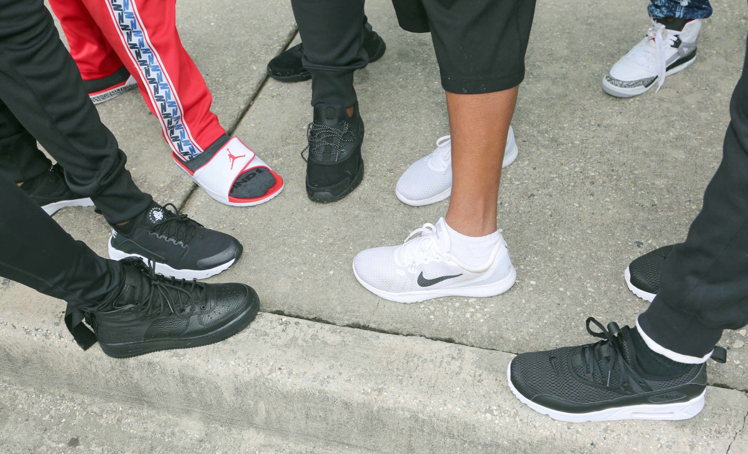 Demonstrators show off their Nike shoes during a demonstration against Kenner Mayor Ben Zahn's Nike Ban memorandum at Susan Park Gymnasium in Kenner on Monday, September 10, 2018.  (Photo by Peter G. Forest)  Instagram:  @forestphoto_llc