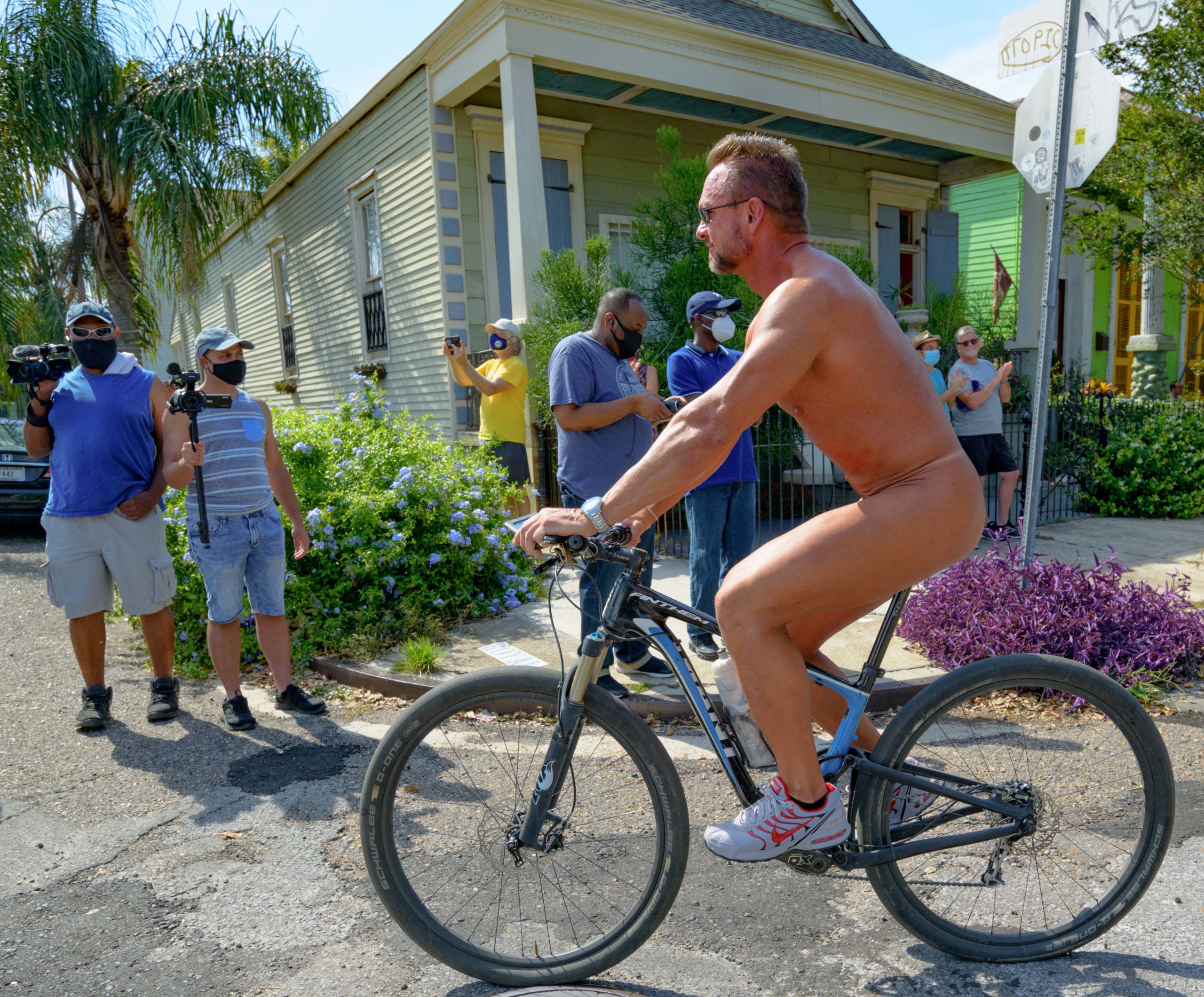 Riders in various stages of undress participate in the 12th annual World Naked Bike Ride New Orleans at Markey Park in the Bywater before continuing on to the French Quarter Saturday, June 13, 2020. The group also passed by a separate group of riders in the French Quarter taking part in the Motorcade for Pride / Rally for LGBTQ Lives. Both rides included LGBTQ+ riders.  World Naked Bike Ride NOLA states on its website that the purpose of the ride is to promote a cleaner, safer, body-positive world to the masses in a free, non-sexual, fun bike ride. “Our mission is to take to the streets riding nude as the best way of defending our dignity as humans on bikes. We expose just how vulnerable we are as cyclists on our own city streets. We also ride to protest the world's oil dependency, mainly cars, that negatively impacts the environment on this planet.” Photo by Matthew Hinton