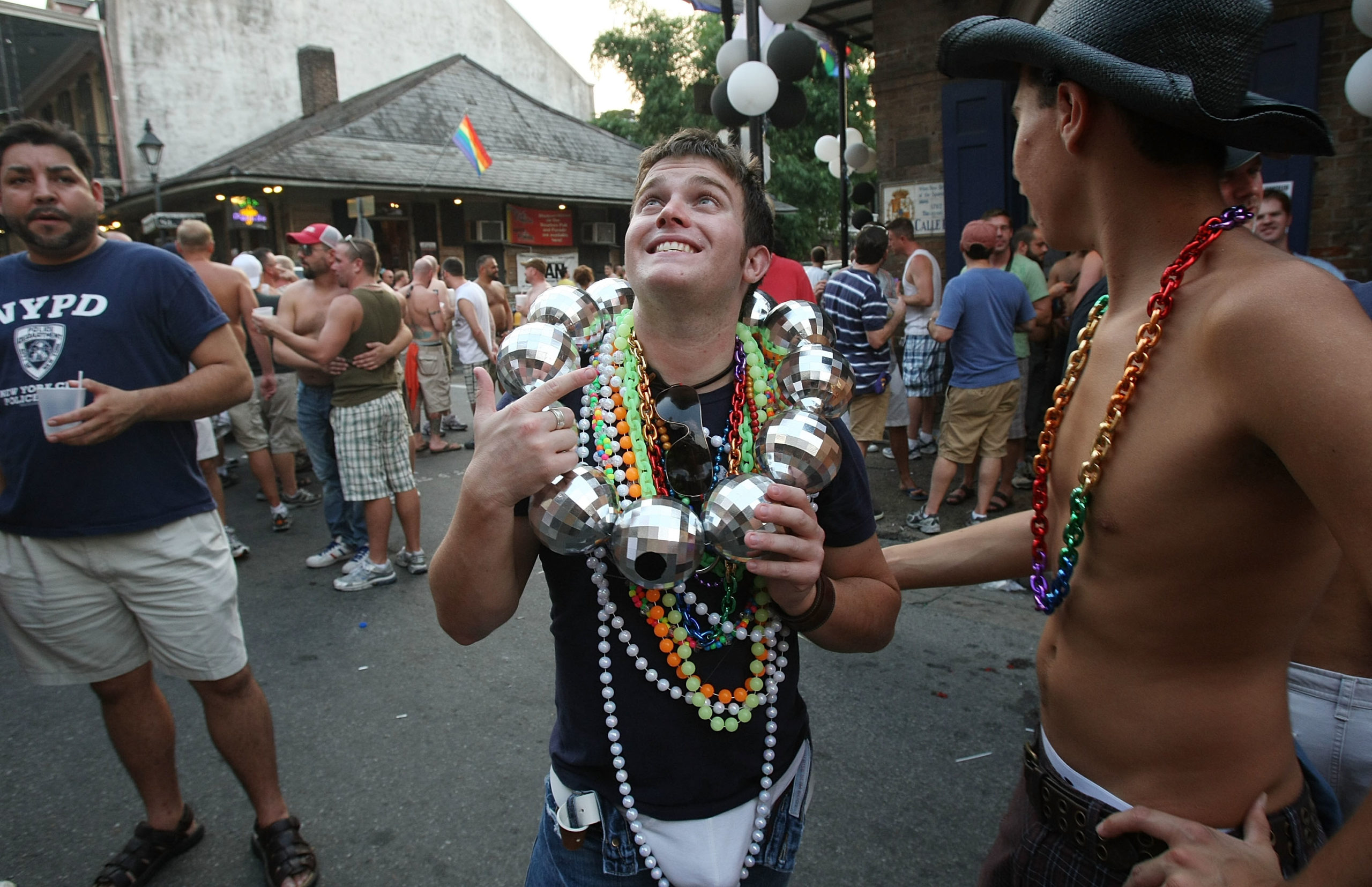 NEW ORLEANS - AUGUST 30:  Men party on Bourbon Street during the gay festival Southern Decadence August 30, 2008 in New Orleans, Louisiana. Hurricane Gustav has strengthened into a dangerous Category 4 storm as it heads toward the Gulf Coast.  (Photo by Mario Tama/Getty Images)