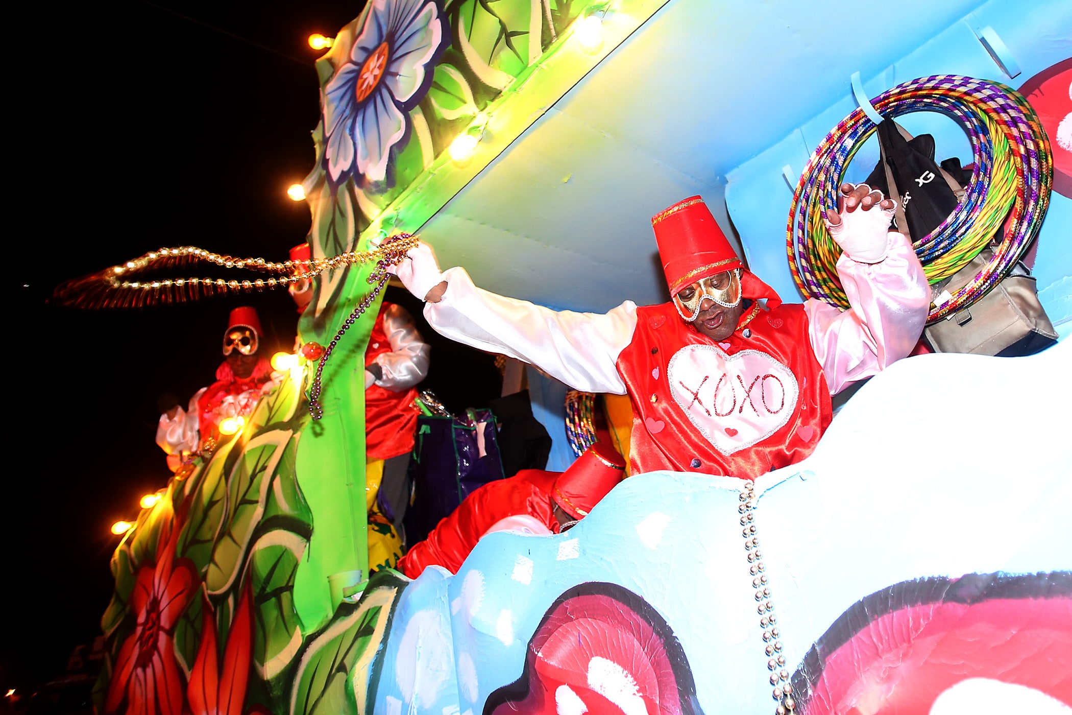 Riders work the crowd as the 300 members of the Krewe of Oshun rolled down the Uptown parade route with an 18-float parade entitled “The Message is Love”. Cordell Chambliss reigned as Shango and Joan Ann Brown was Queen Oshun as the krewe presented their 24th annual parade on Friday, February 14, 2020. (Photo by Michael DeMocker)