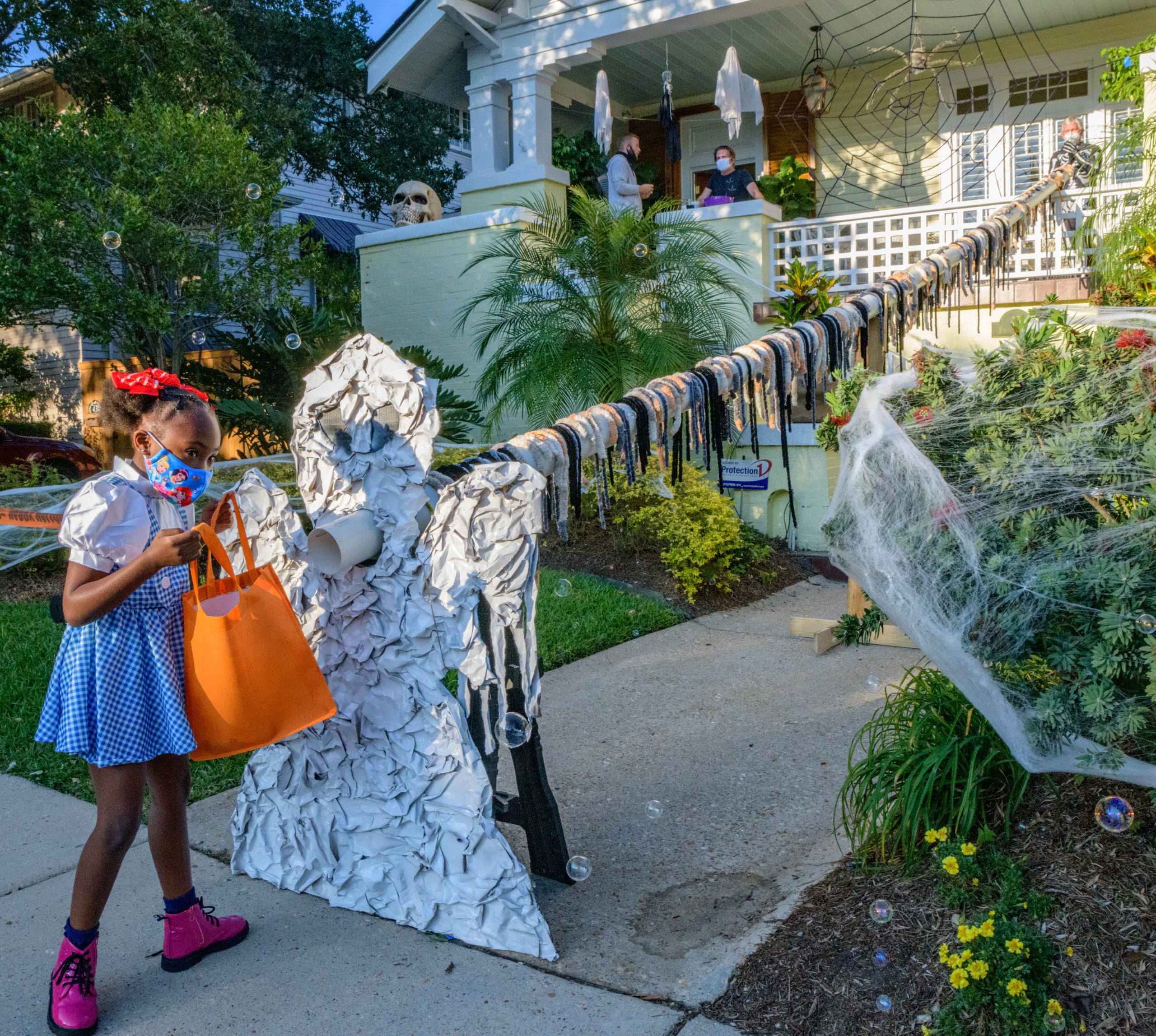 Once in a Blue Moon, Halloween 2020 began with trick-or-treating for the kids with a specially designed social-distance tube to deliver candy by Mark Romig, the voice of the Saints, in the Fontainebleau neighborhood of New Orleans. Photo by Matthew Hinton