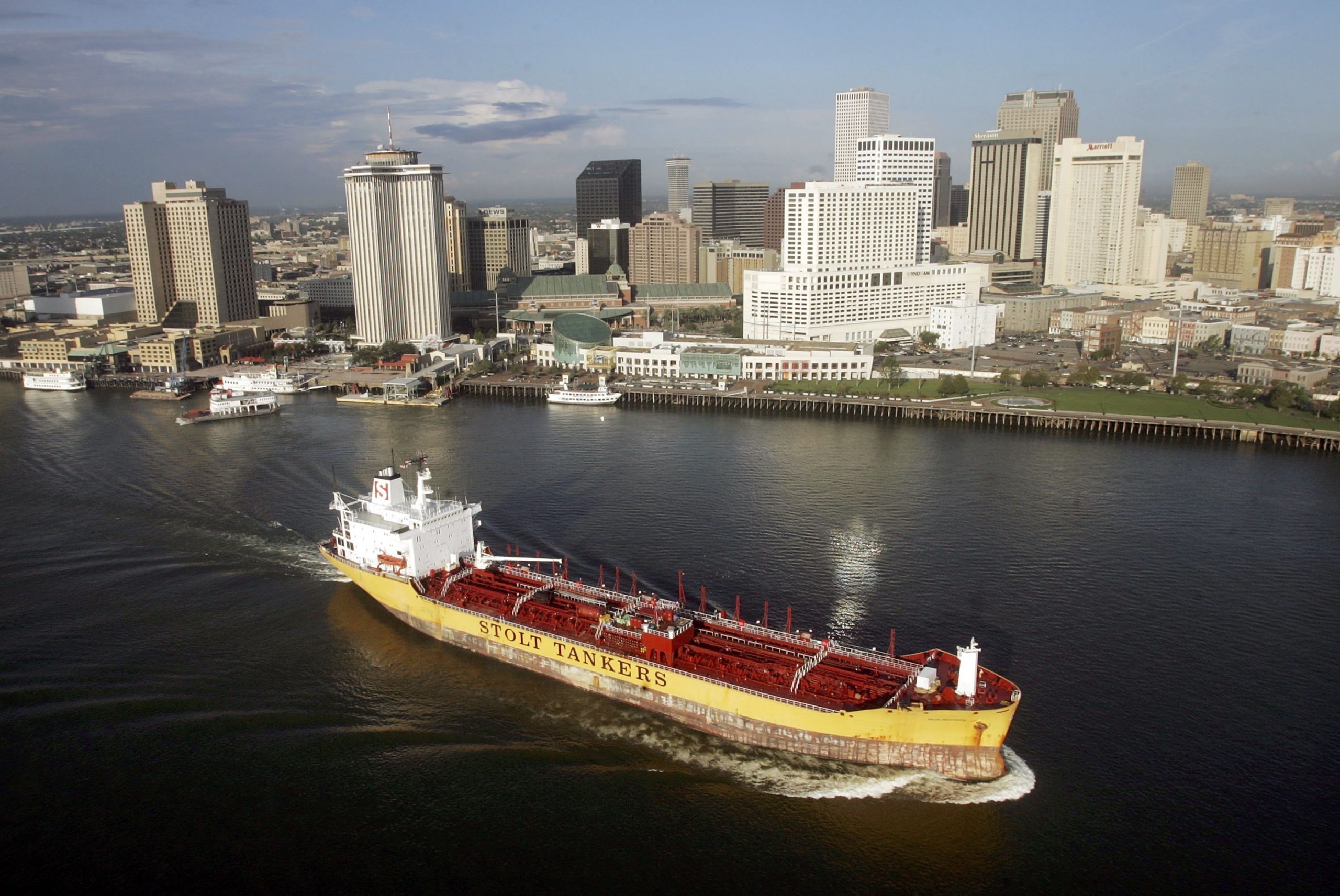 NEW ORLEANS - AUGUST 25:  A container ship moves along the Mississippi River with the city skyline in the background August 25, 2006 in New Orleans, Louisiana. The first anniversary of Hurricane Katrina is August 29.  (Photo by Mario Tama/Getty Images)