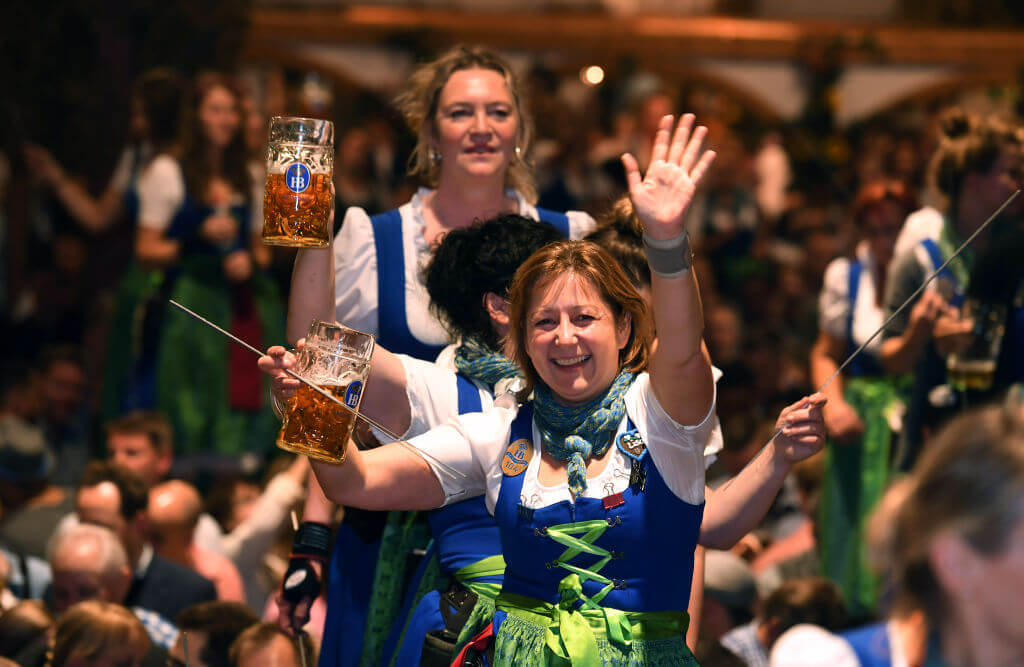 07 October 2018, Bavaria, Munich: Servants dance on the tables in the Hofbräuzelt at the Oktoberfest on the last day of the Wiesn at the Kehraus. The biggest folk festival in the world lasted from 22.09. to 07.10.2018. Photo: Felix Hörhager/dpa (Photo by Felix Hörhager/picture alliance via Getty Images)