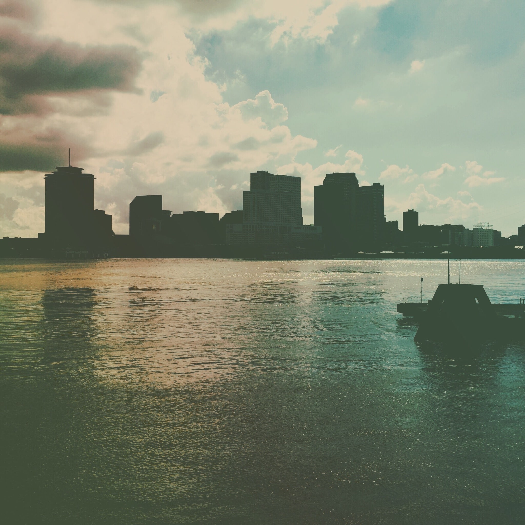 Cloudy Sky Above Waterfront Buildings