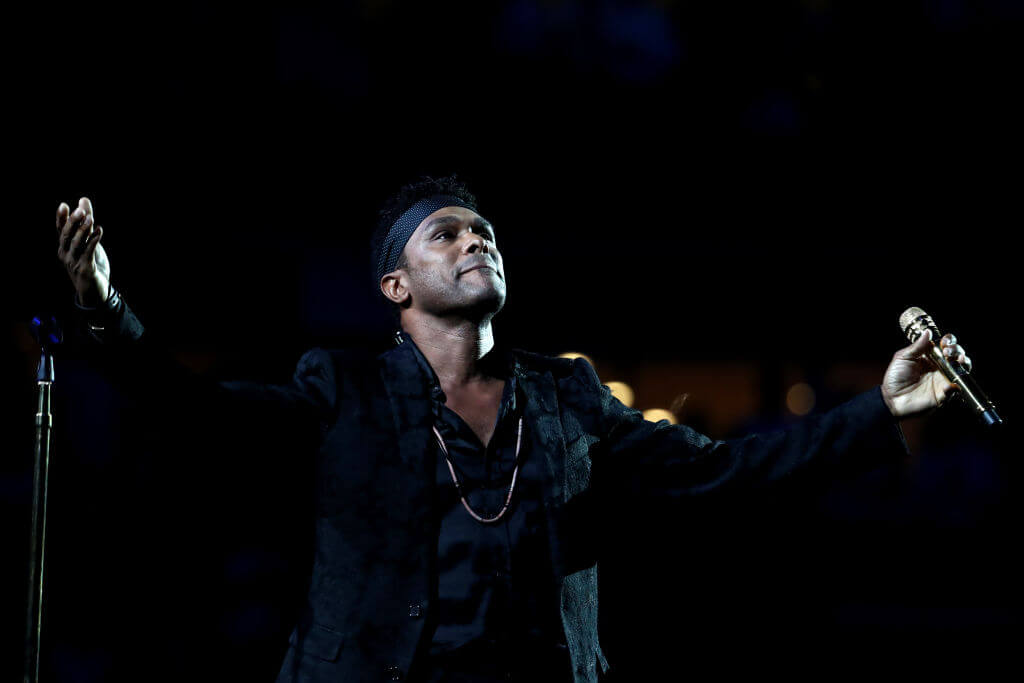 NEW YORK, NY - AUGUST 27:  Singer-songwriter Maxwell performs the National Anthem during the opening night ceremony at Arthur Ashe Stadium on Day One of the 2018 US Open at the USTA Billie Jean King National Tennis Center on August 27, 2018 in the Flushing neighborhood of the Queens borough of New York City.  (Photo by Al Bello/Getty Images)