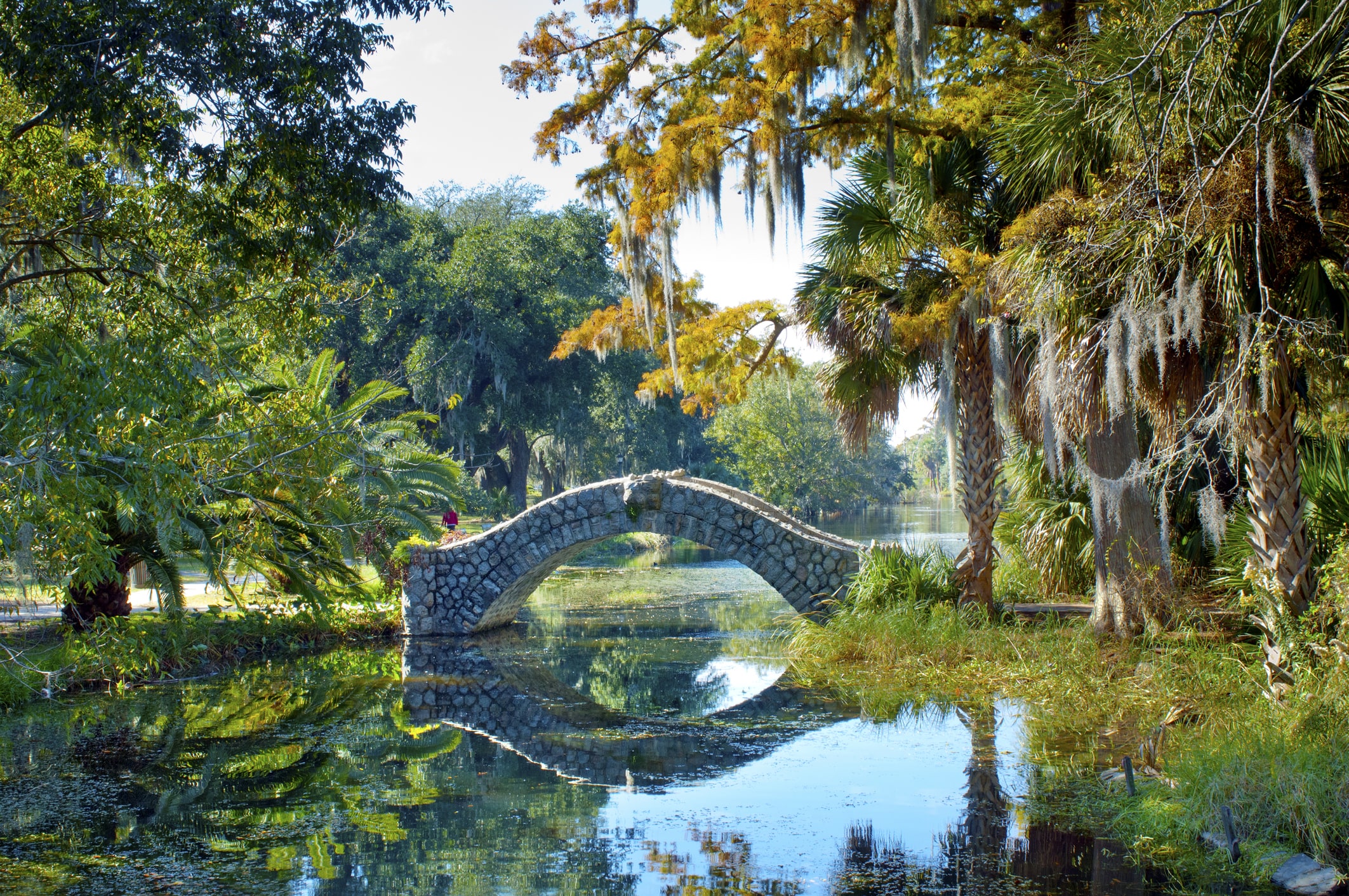The Langles Bridge, built in 1902, is an old stone bridge that crosses a preserved bayou in City Park, one of the United States oldest urban parks in New Orleans. The park holds the world's largest collection of mature live oaks.